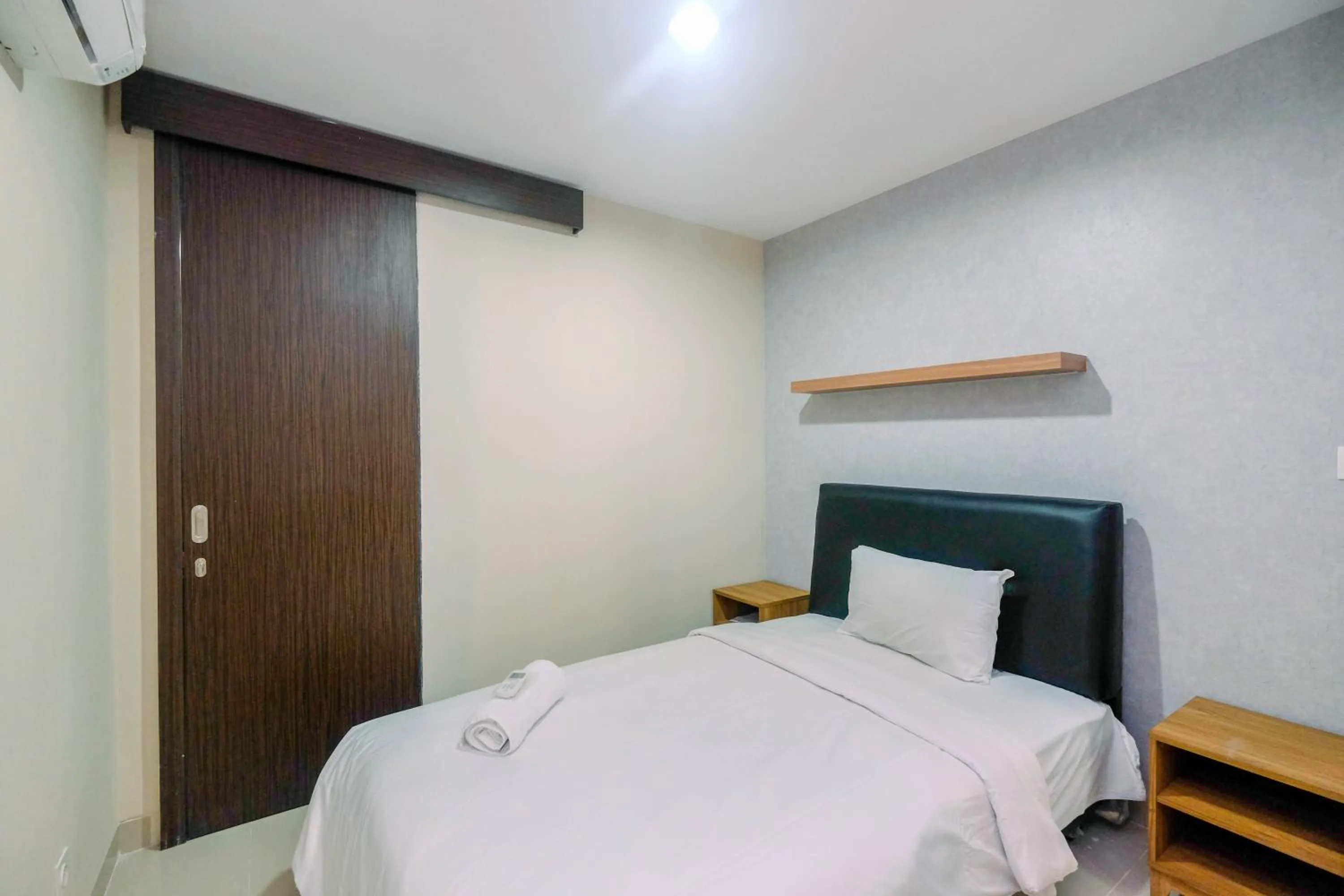 Bed in Cozy 2BR Apartment Nine Residence with City View By Travelio