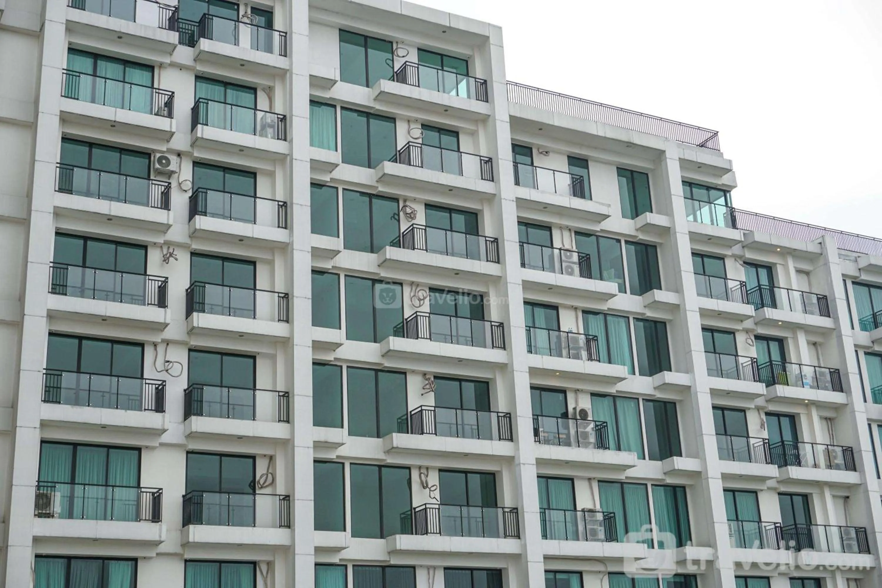 Bed in Cozy 2BR Apartment Nine Residence with City View By Travelio