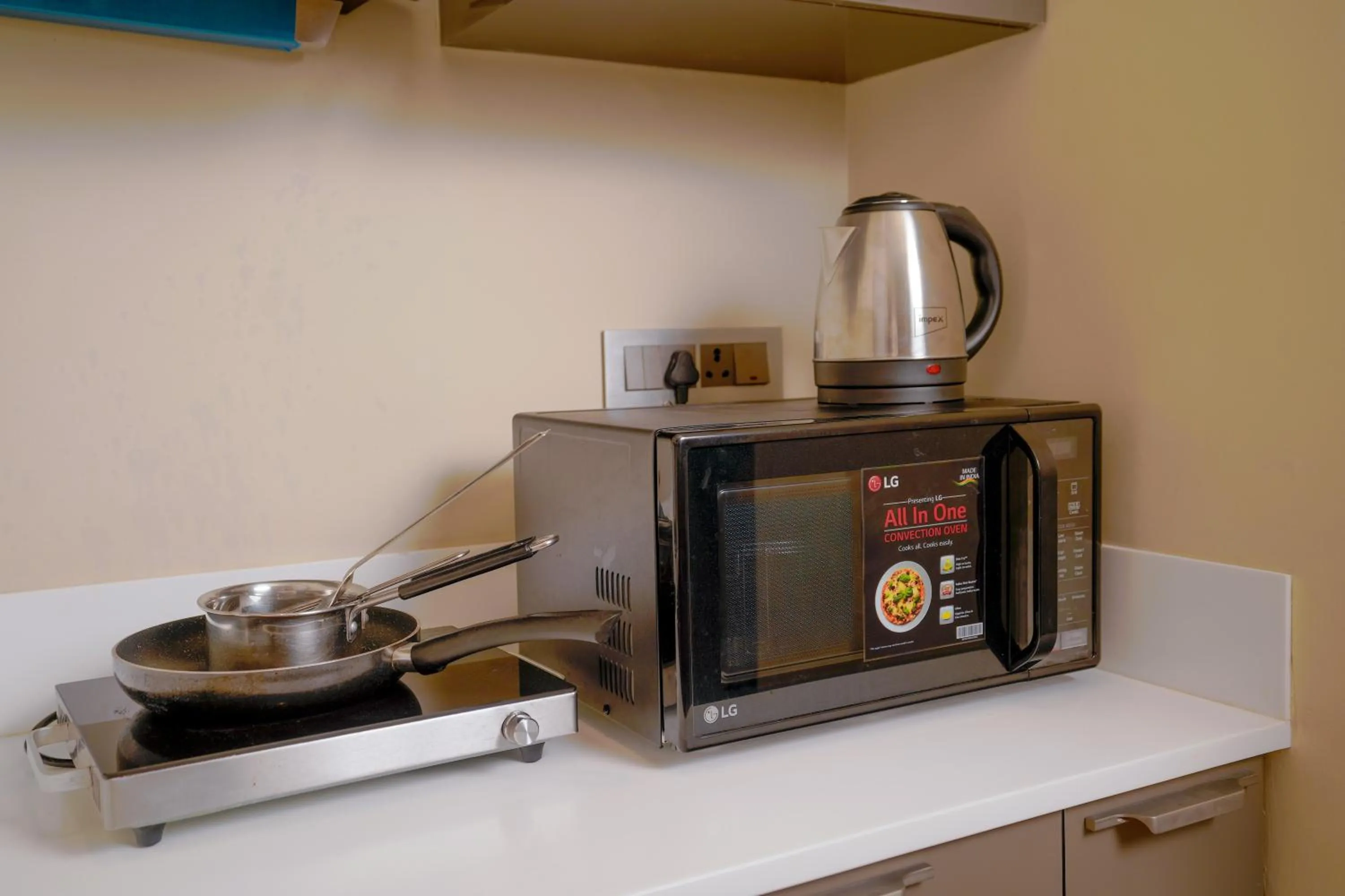 Kitchen or kitchenette in Lazdana Hotel Bangalore