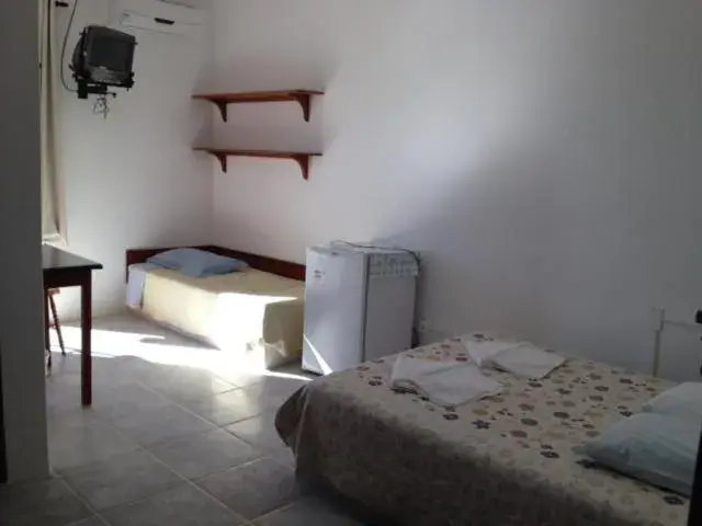 Master Triple Room in Lobo Hotel Master Triple Room in Lobo Hotel