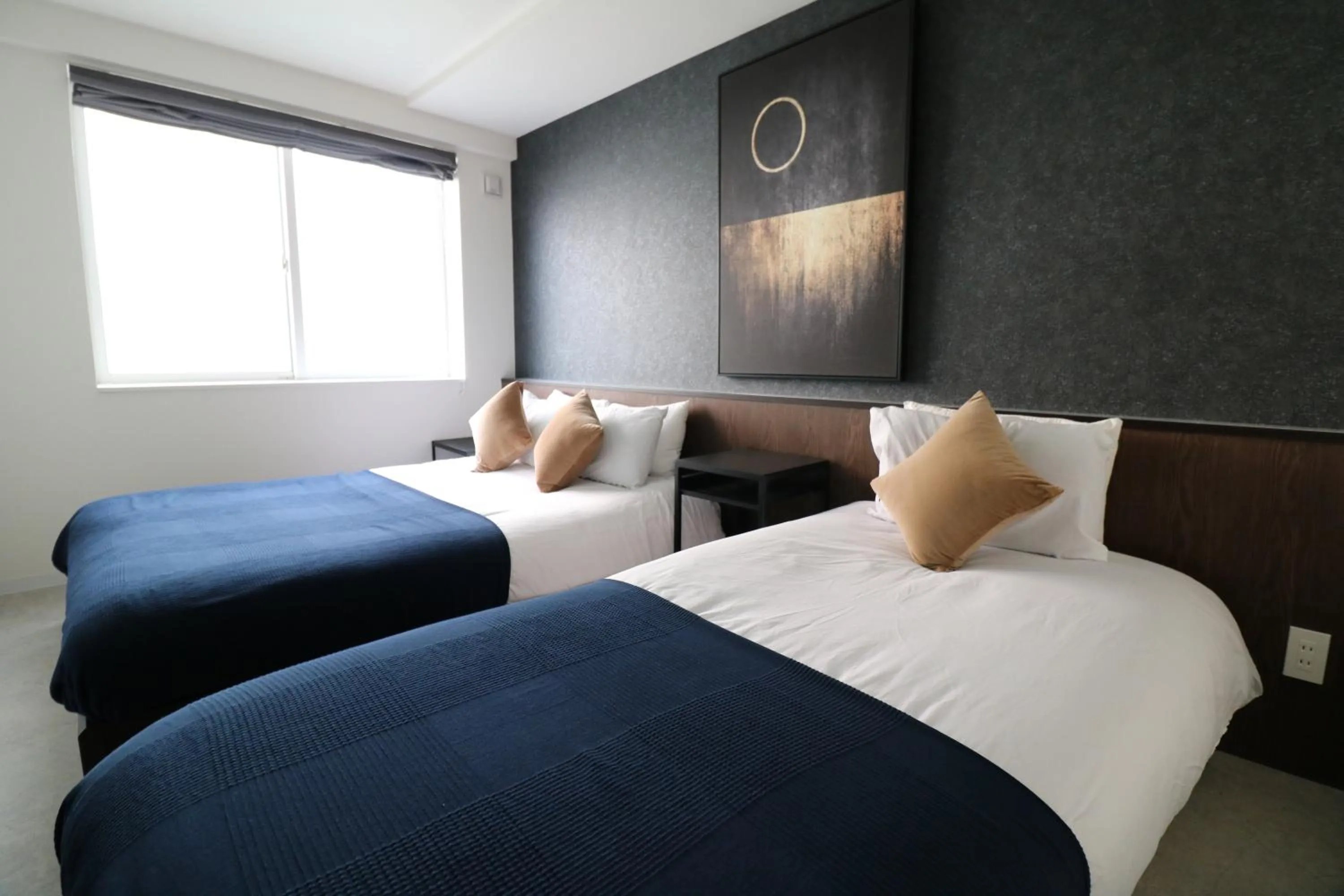 Bed in TAKETO STAY Kotoni