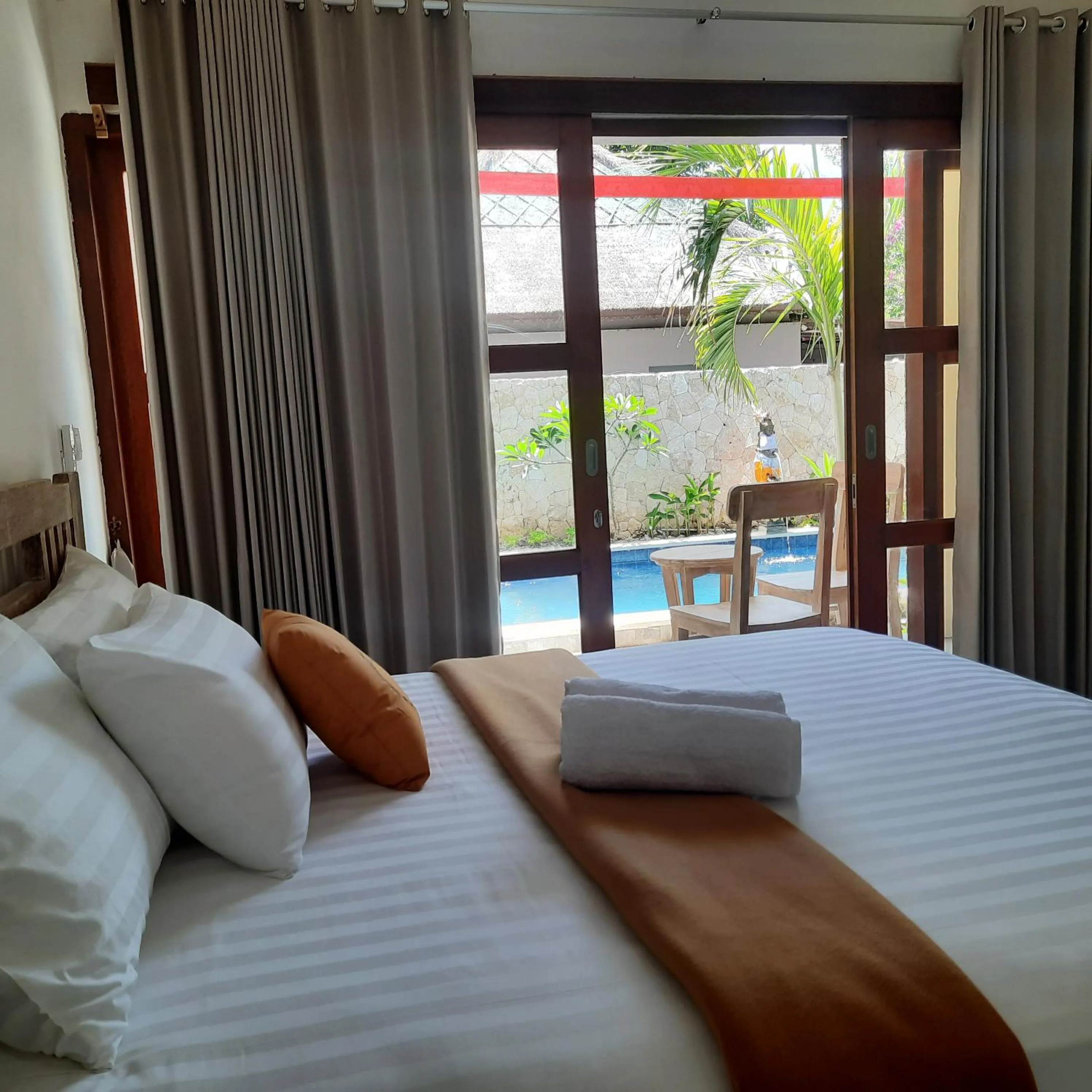 Bed in The Pulau Bungalow