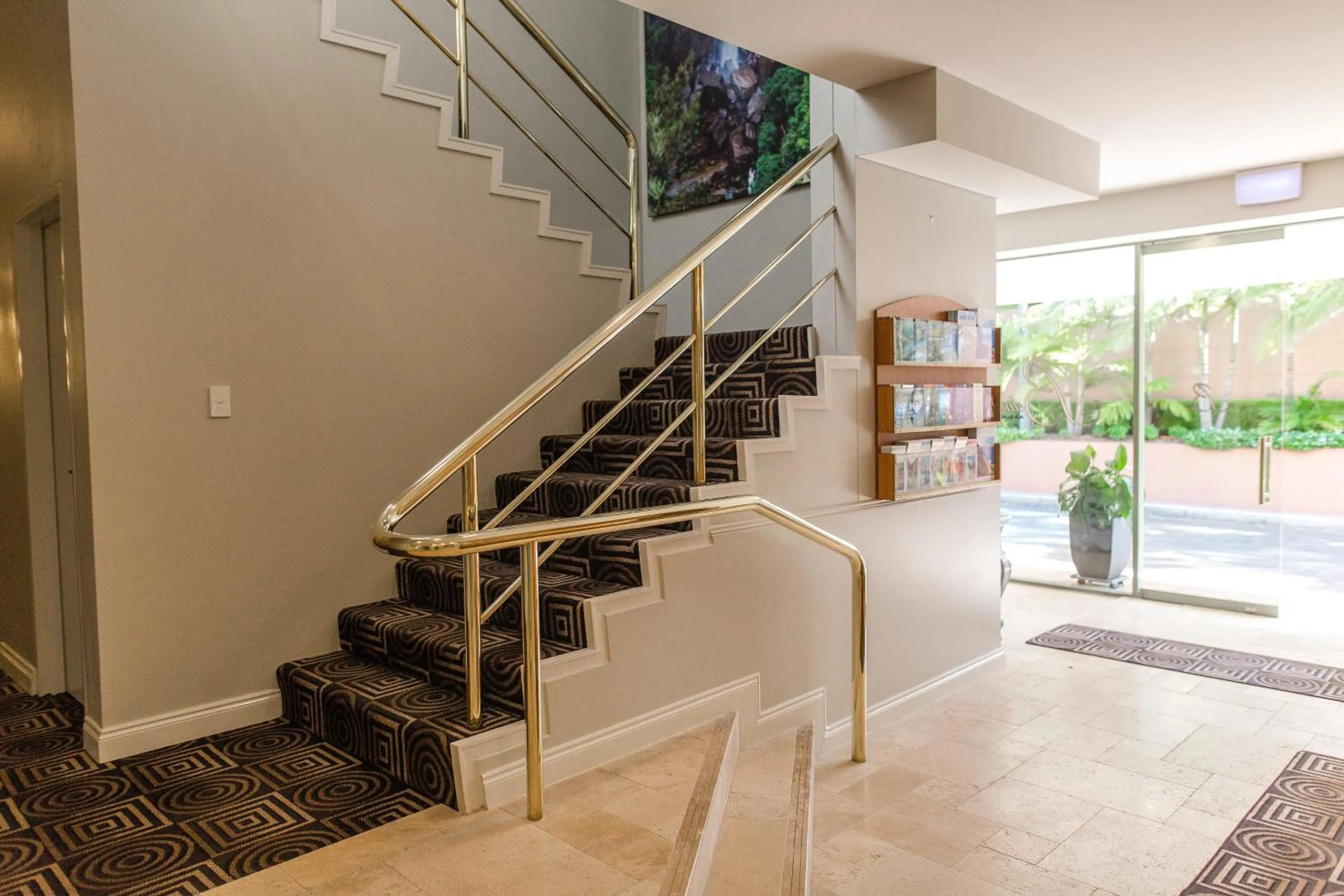 Lobby or reception in The Belmore Apartments Hotel