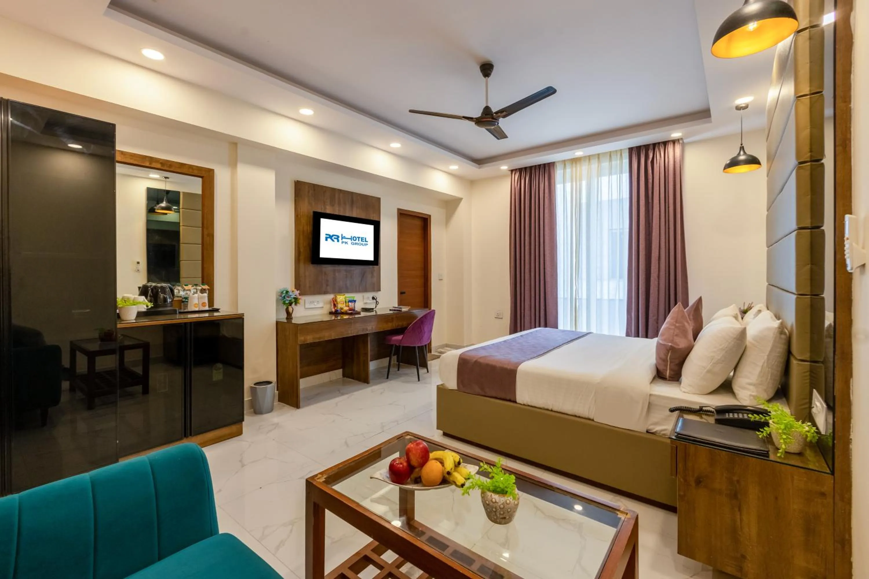 Communal lounge/ TV room, Bed in PK Boutique Hotel Noida Expressway