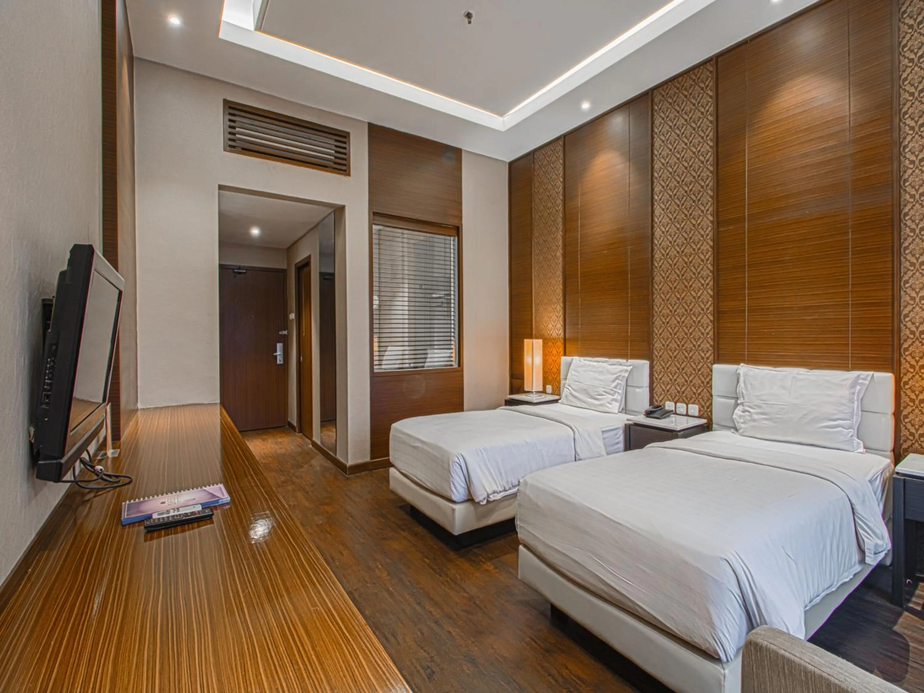 Bed in Grand Arjuna Hotel