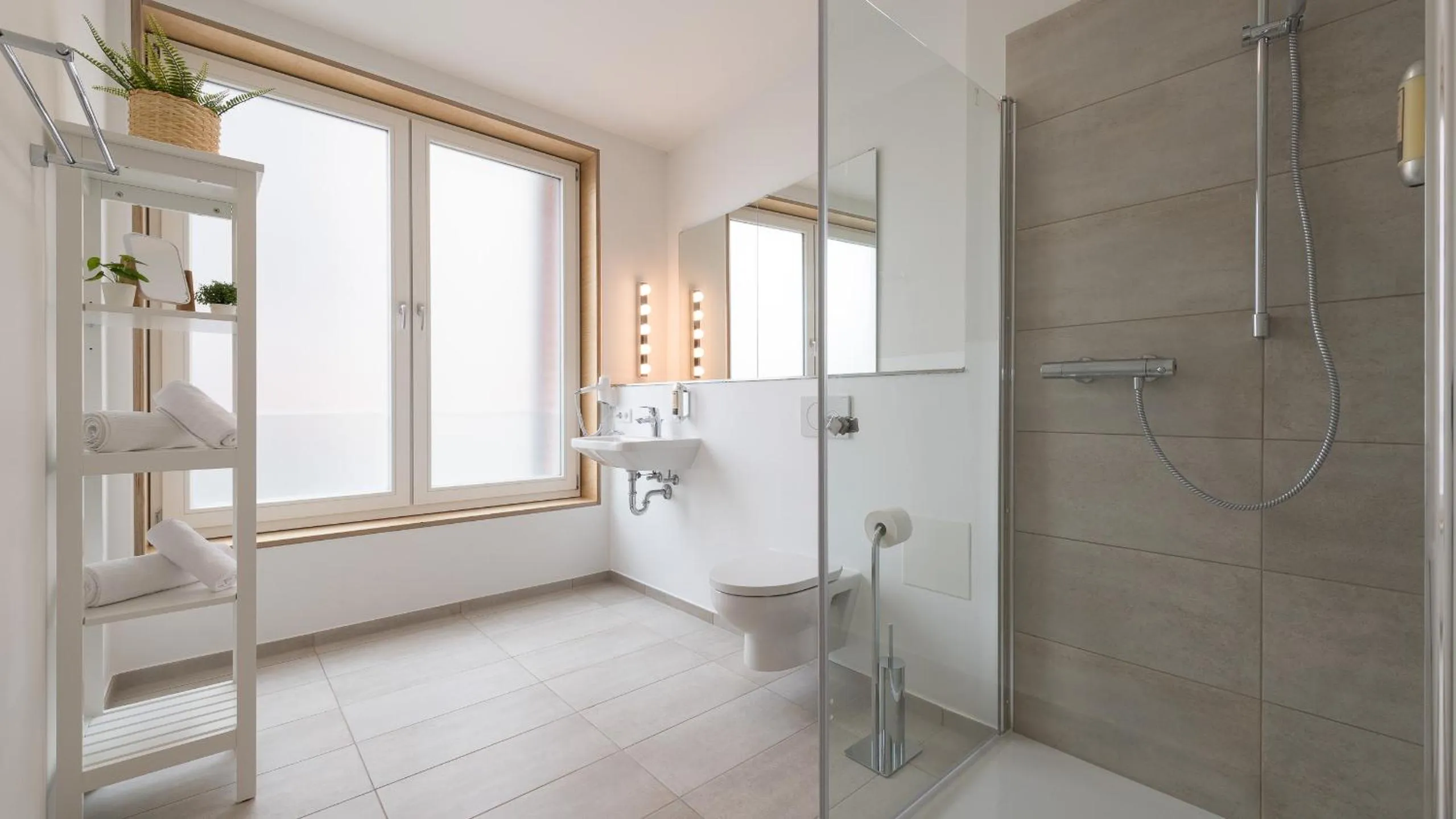 Bathroom in Metropol Apartments & Suites