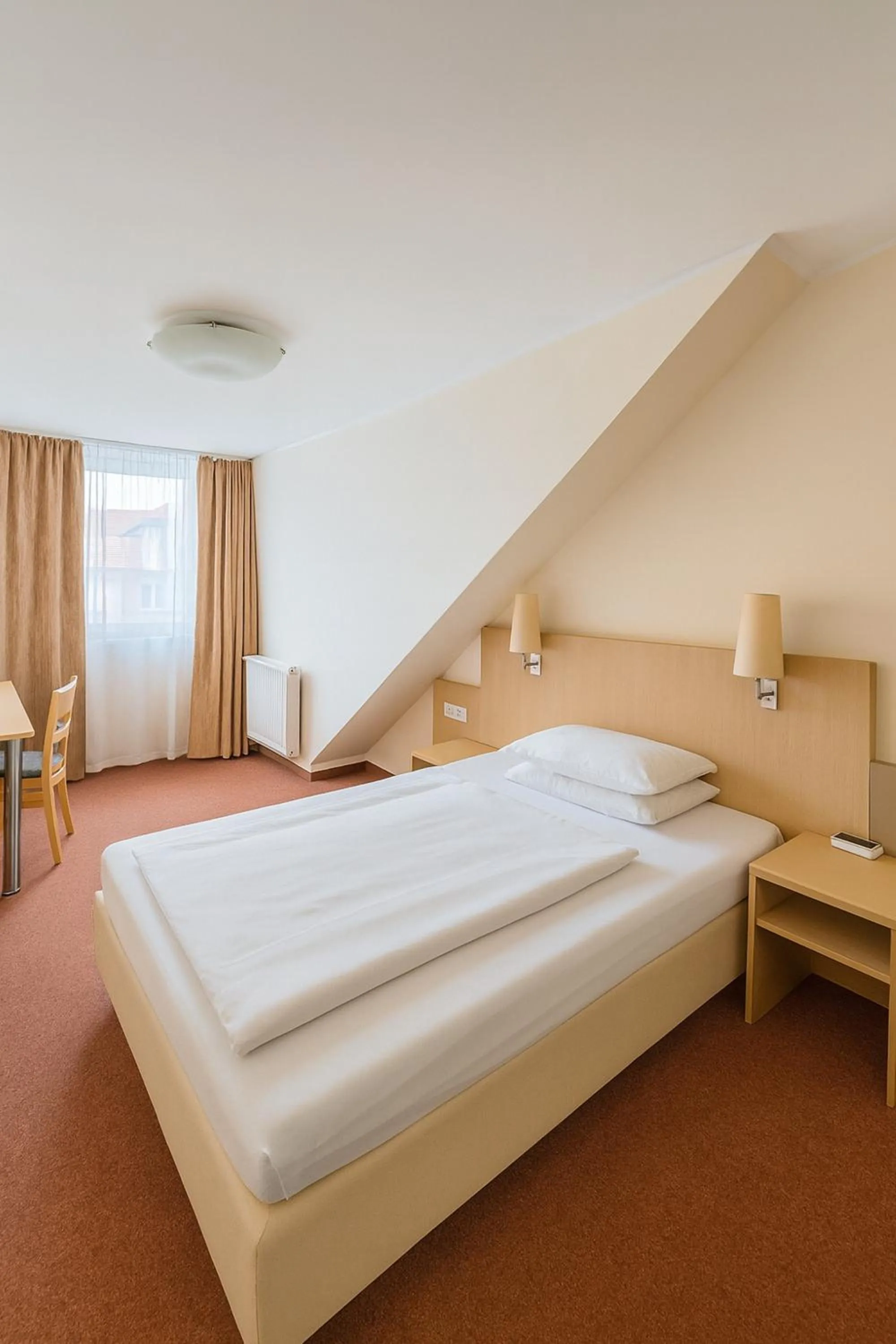 Photo of the whole room, Bed in Atomis Hotel Düsseldorf City