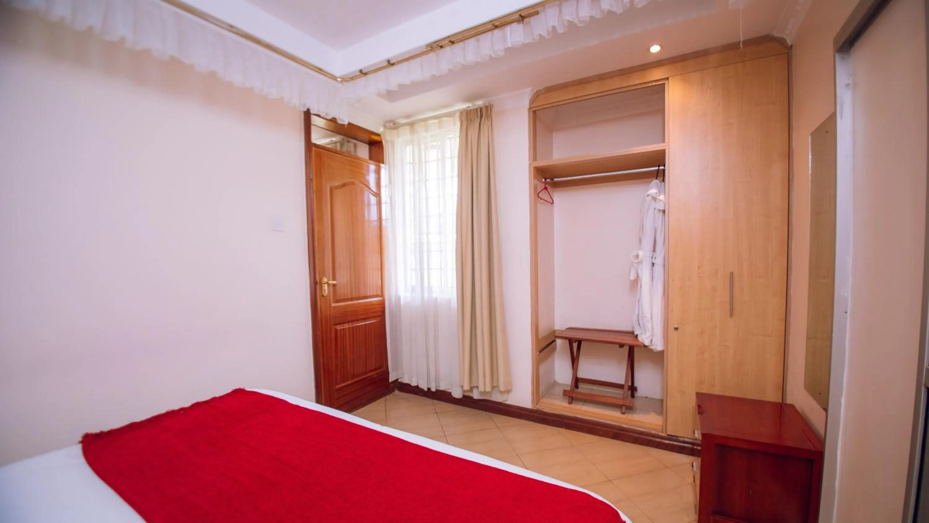 Bedroom in Longview Suites Hotel