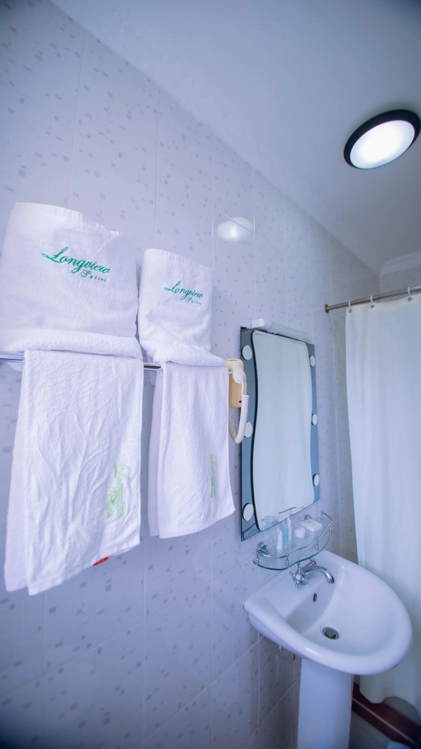 Bathroom in Longview Suites Hotel