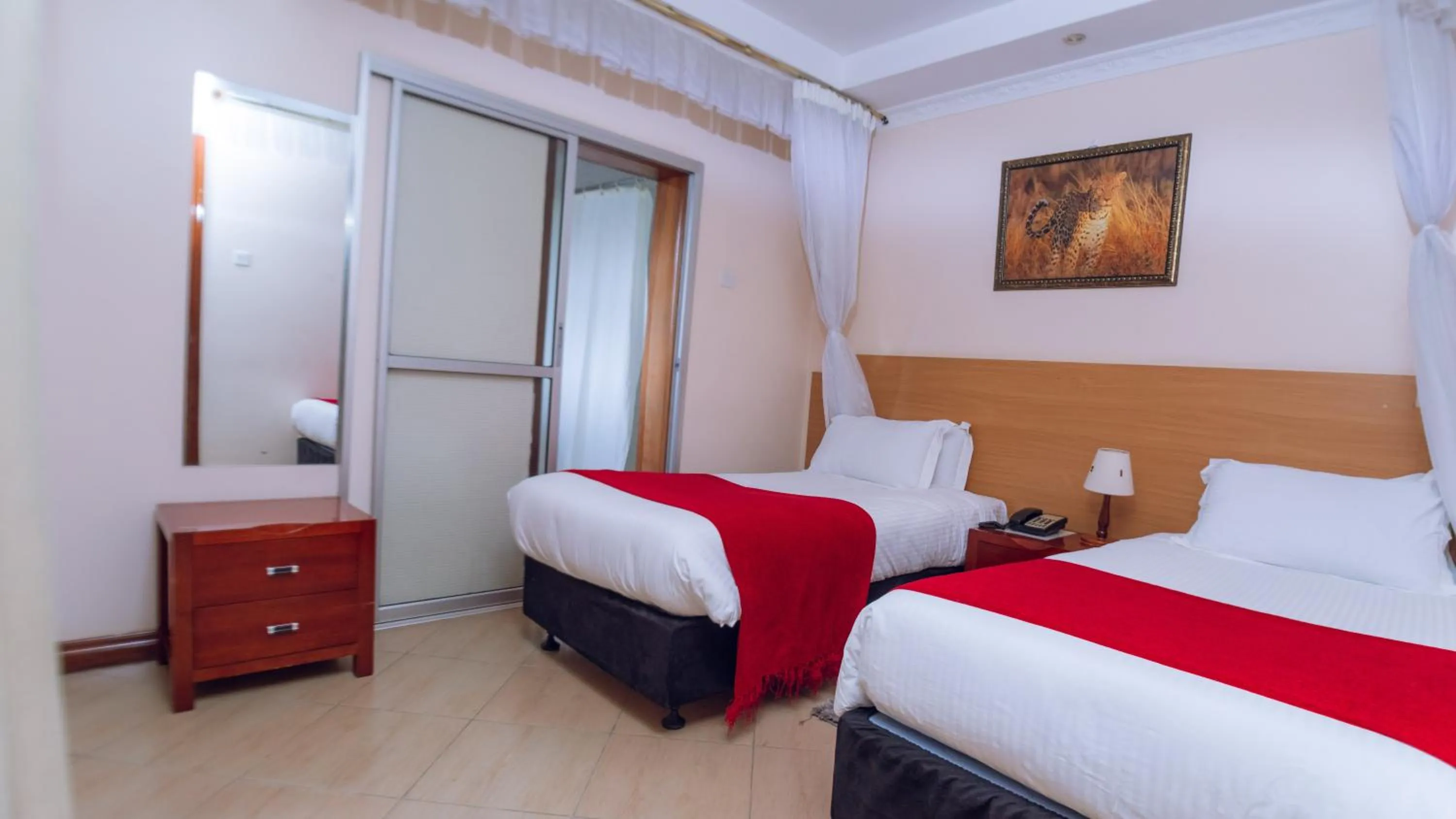 Bed in Longview Suites Hotel