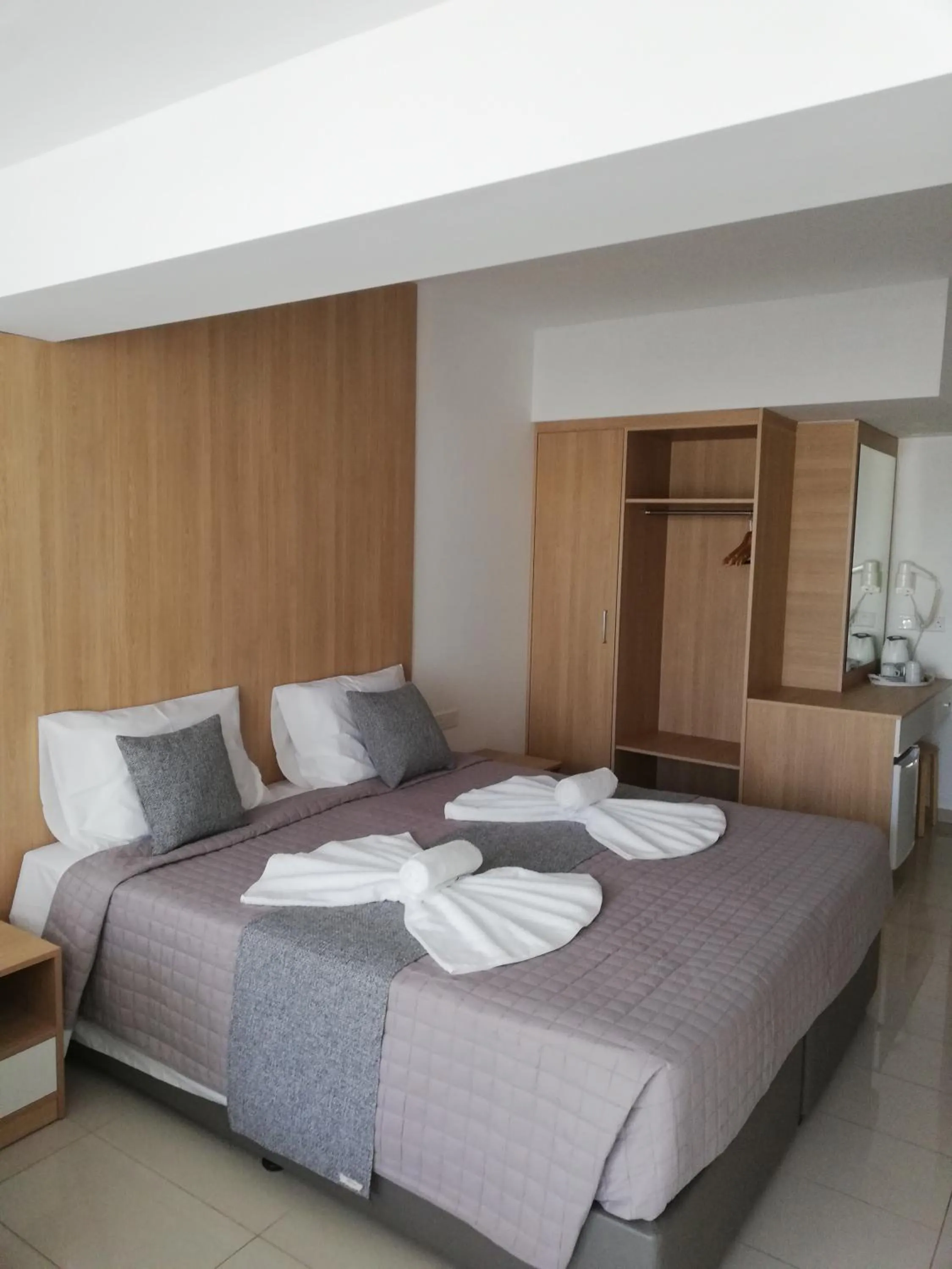 Bed in JOY Hotel Apts