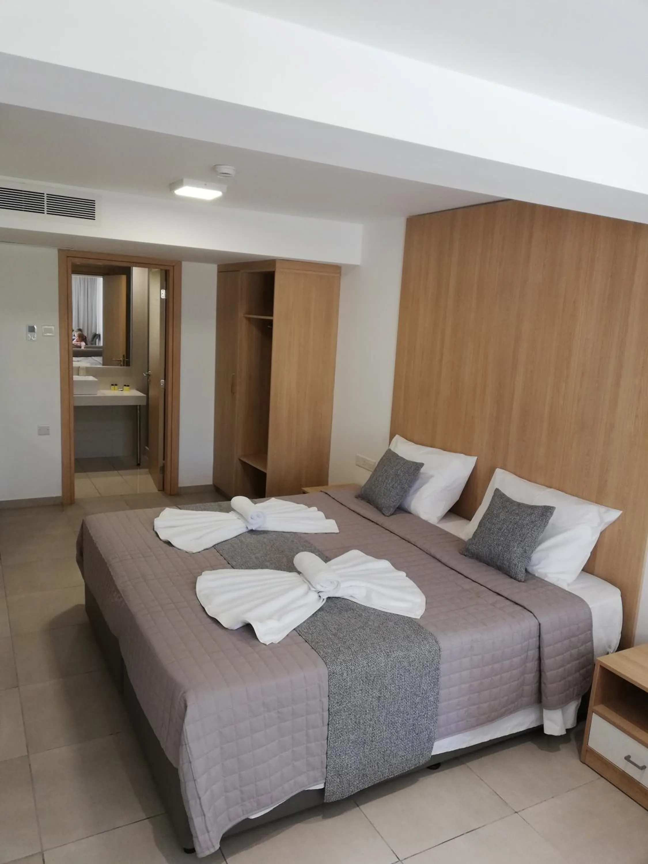 Bed in JOY Hotel Apts