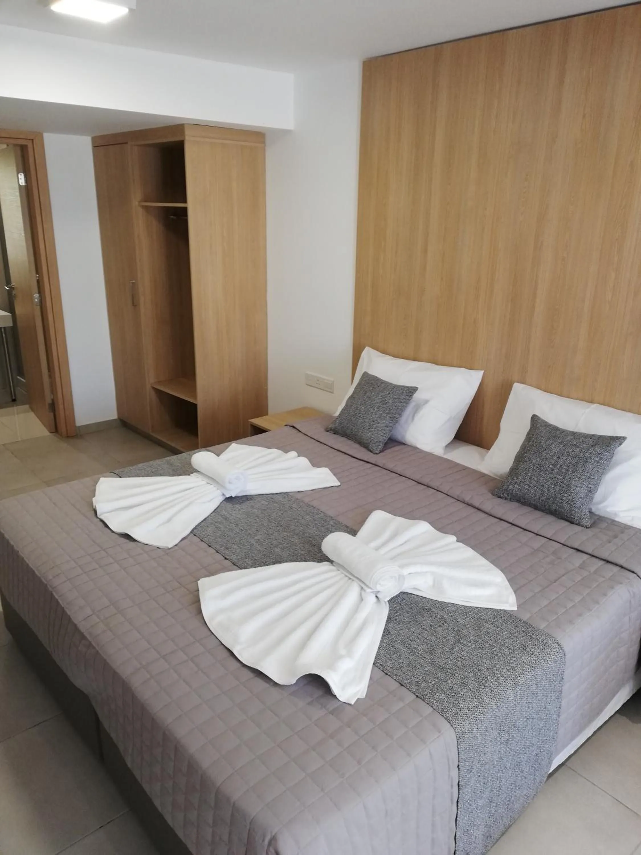 Bed in JOY Hotel Apts