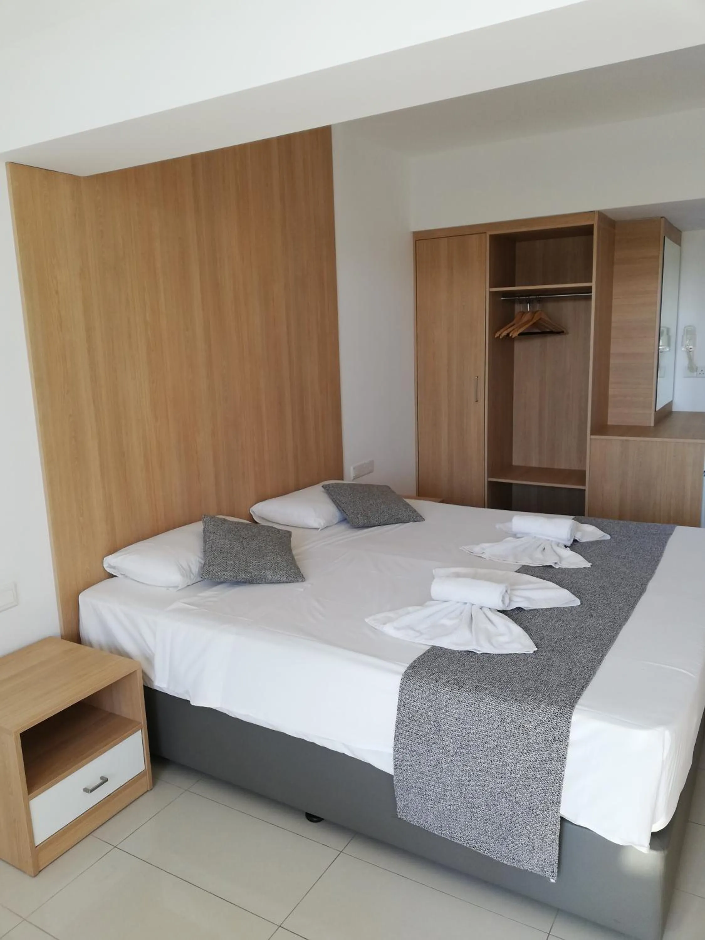 Bed in JOY Hotel Apts