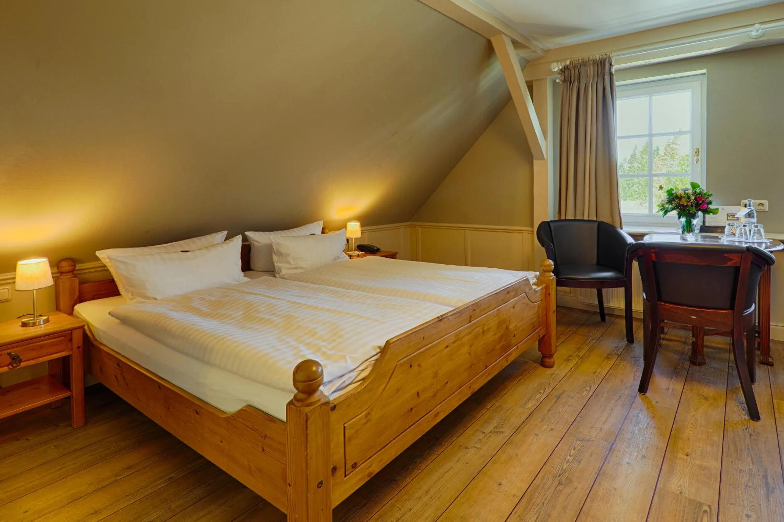 Photo of the whole room, Bed in Meeressterne Hotel Forsthaus Damerow