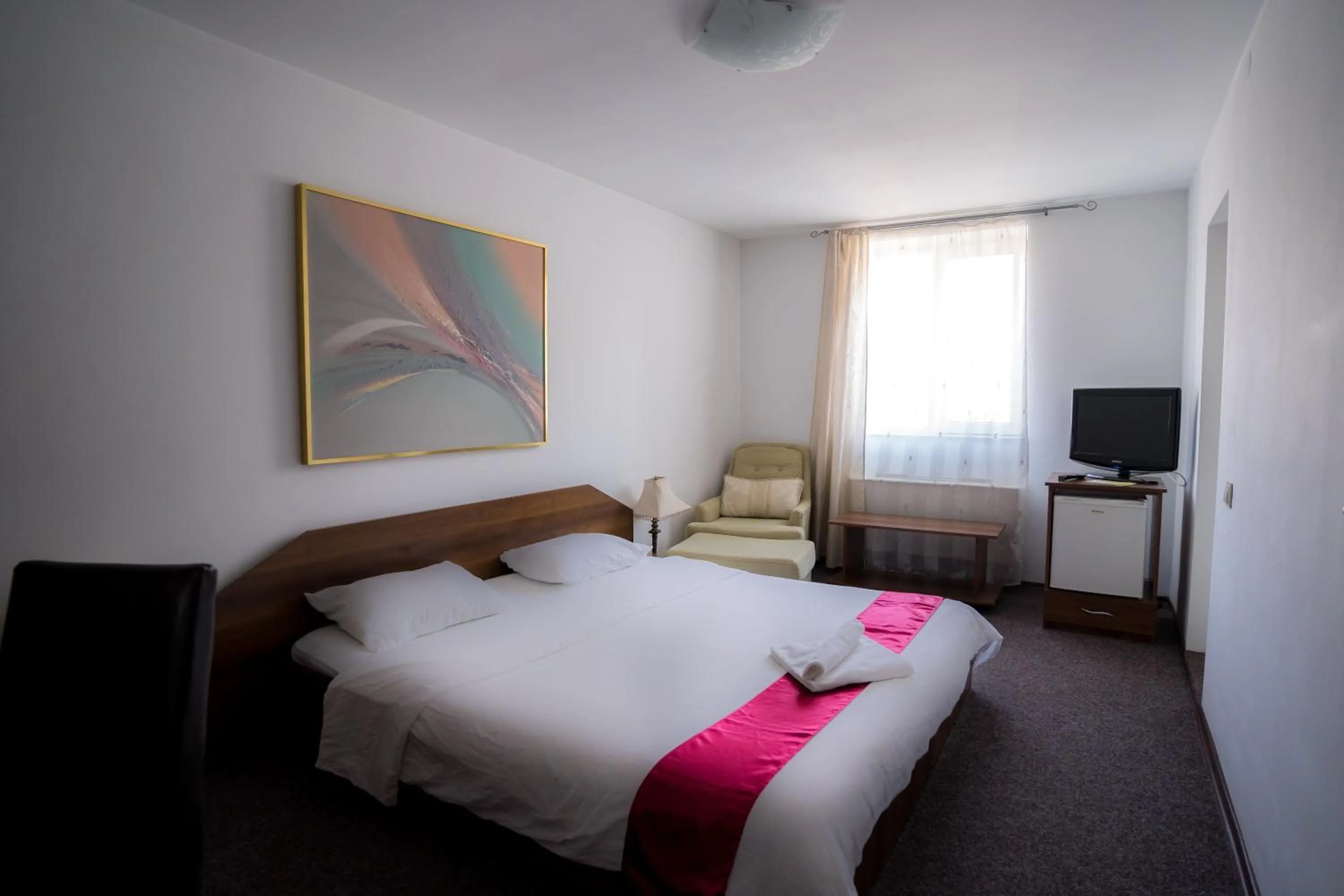 Bed in Pensiunea Dacia Deva