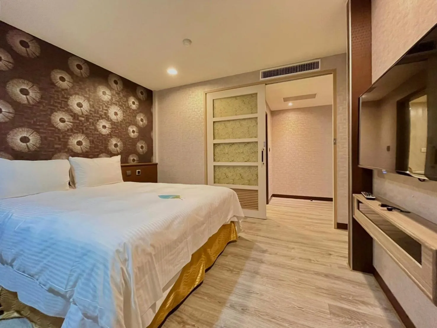 Bed in Grand Earl Hotel