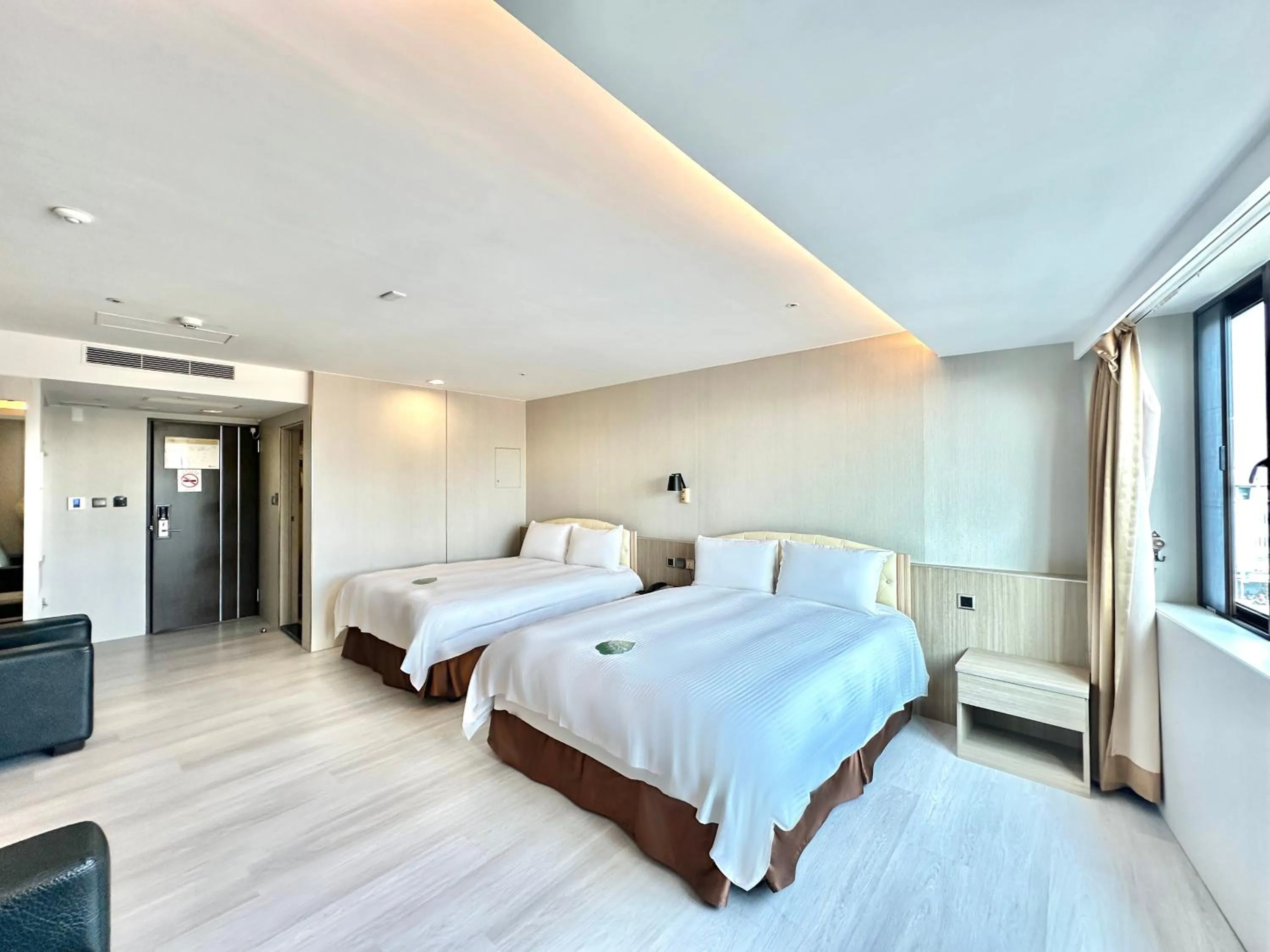 Bed in Grand Earl Hotel