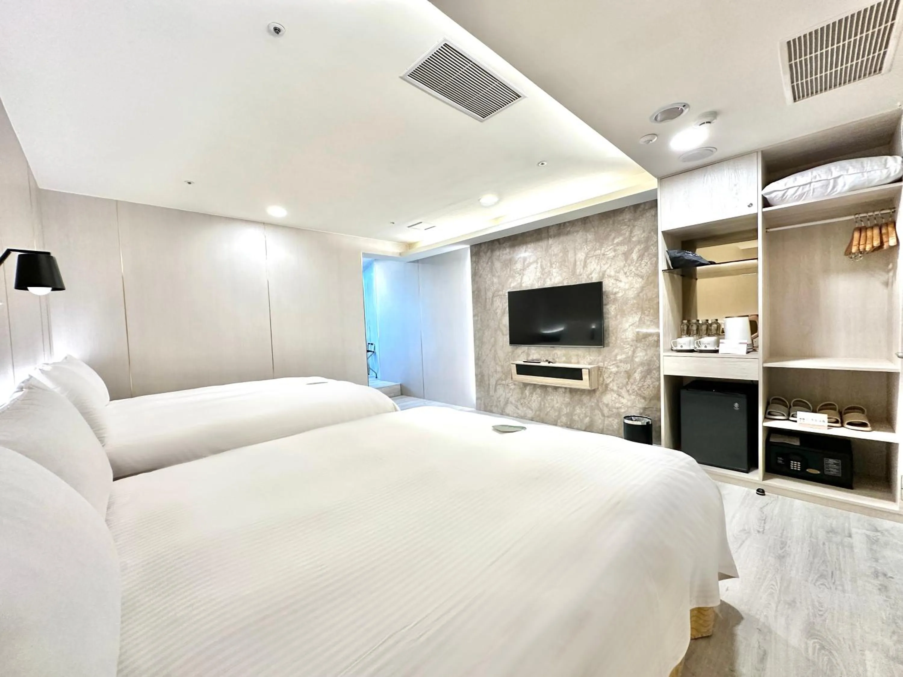 Bed in Grand Earl Hotel