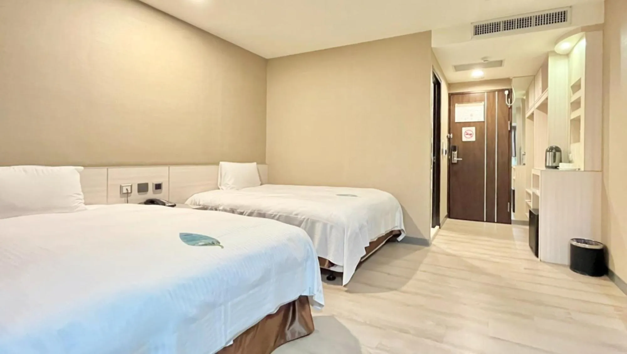 Bed in Grand Earl Hotel