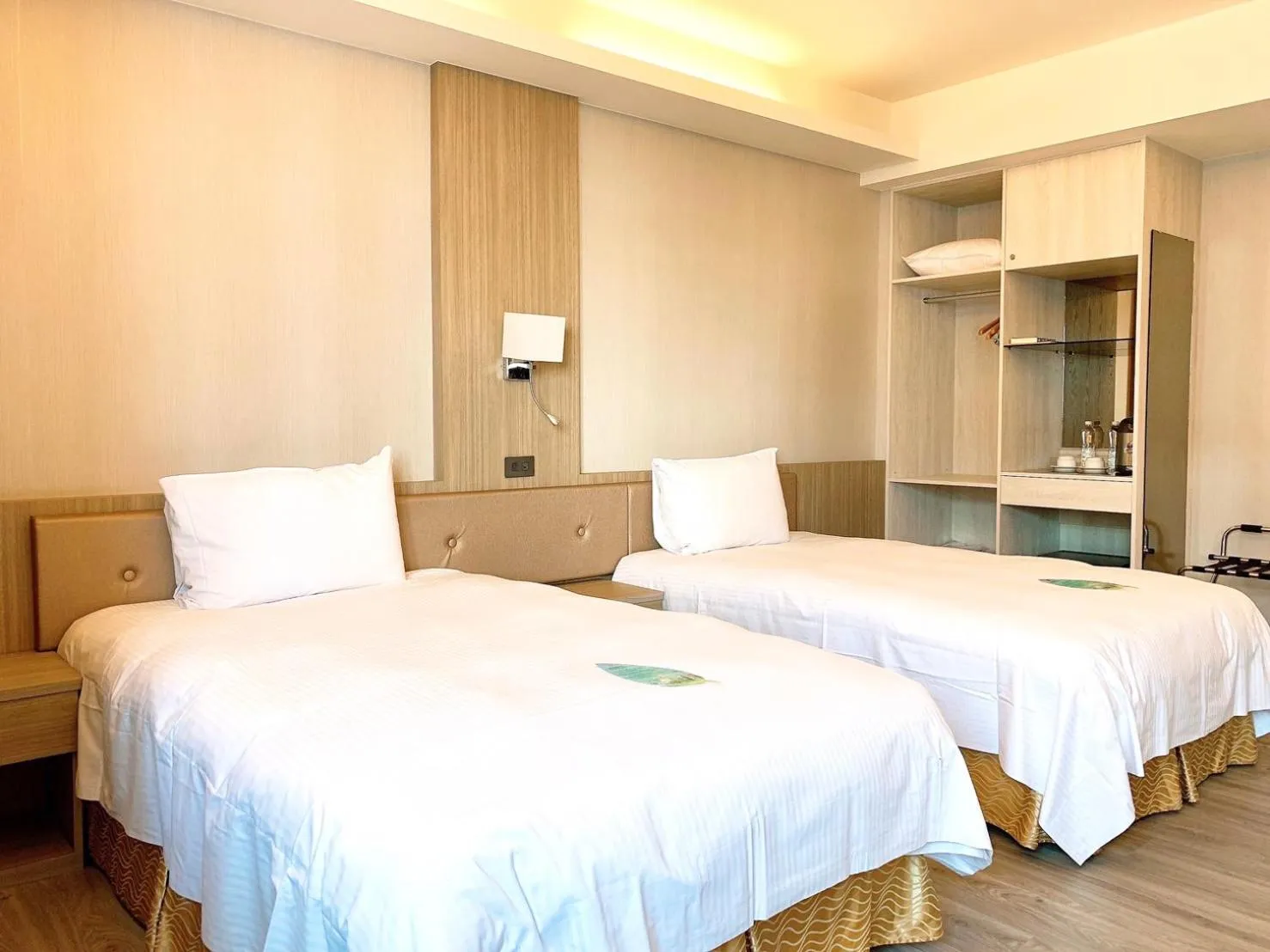 Bed in Grand Earl Hotel