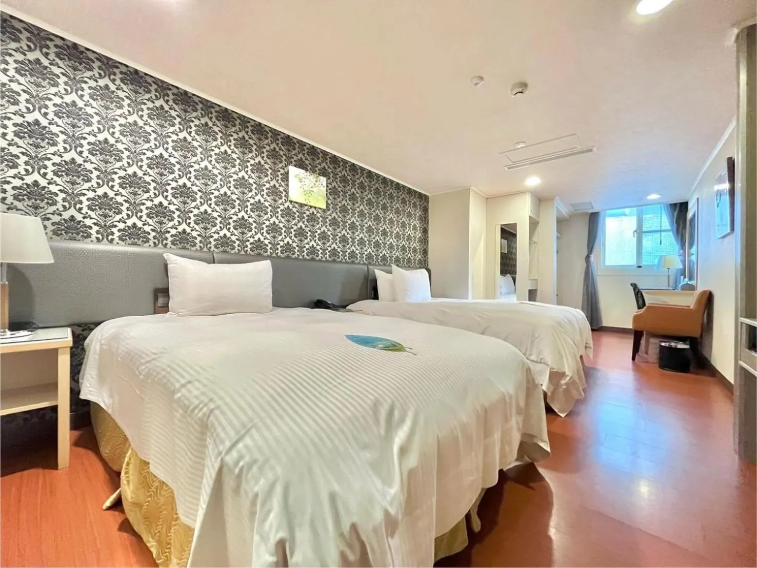 Bed in Grand Earl Hotel