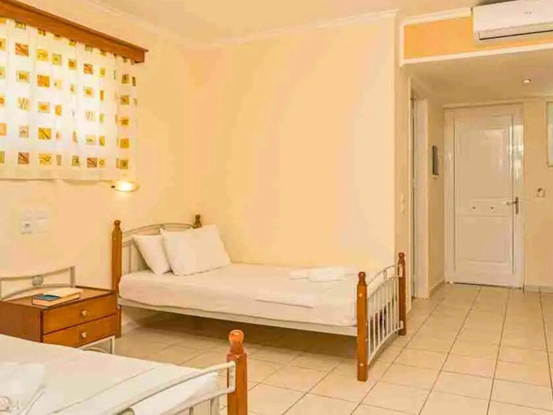 Bed in Manousis ApartHotel