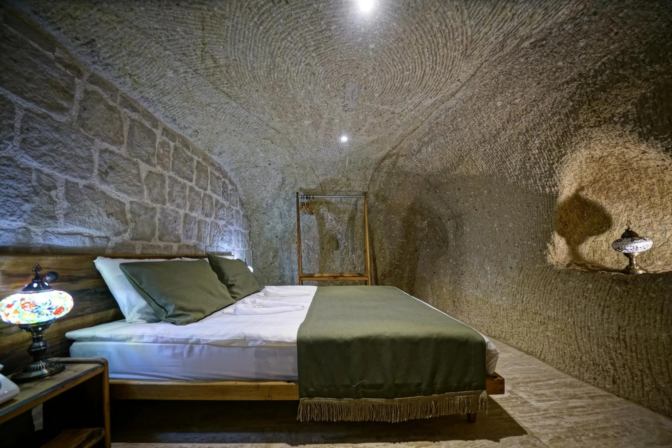 Bed in Vigneron Cave Hotel