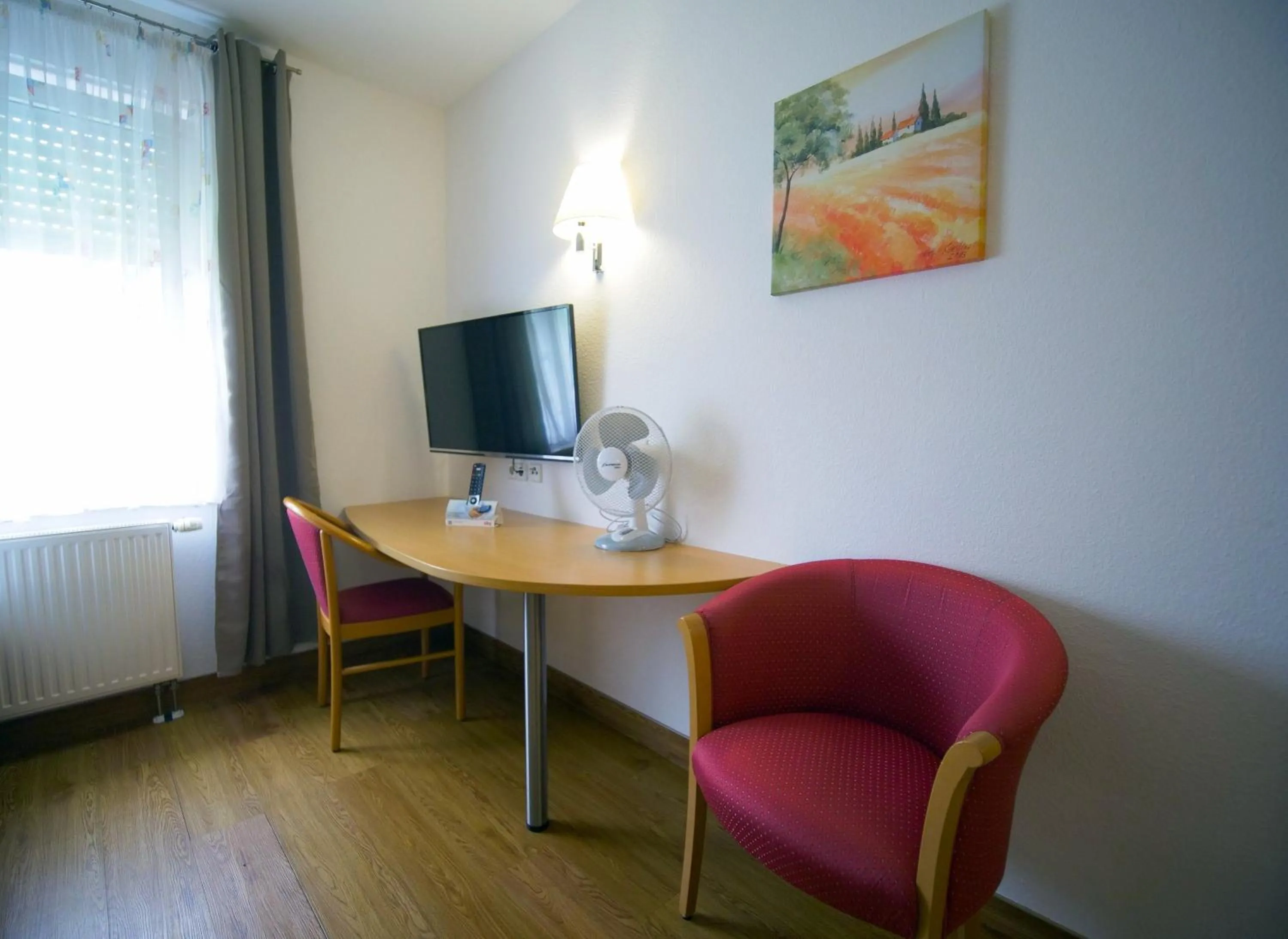 Photo of the whole room in Hotel SunParc - SHUTTLE zum Europa-Park Rust 4km & Rulantica 2km