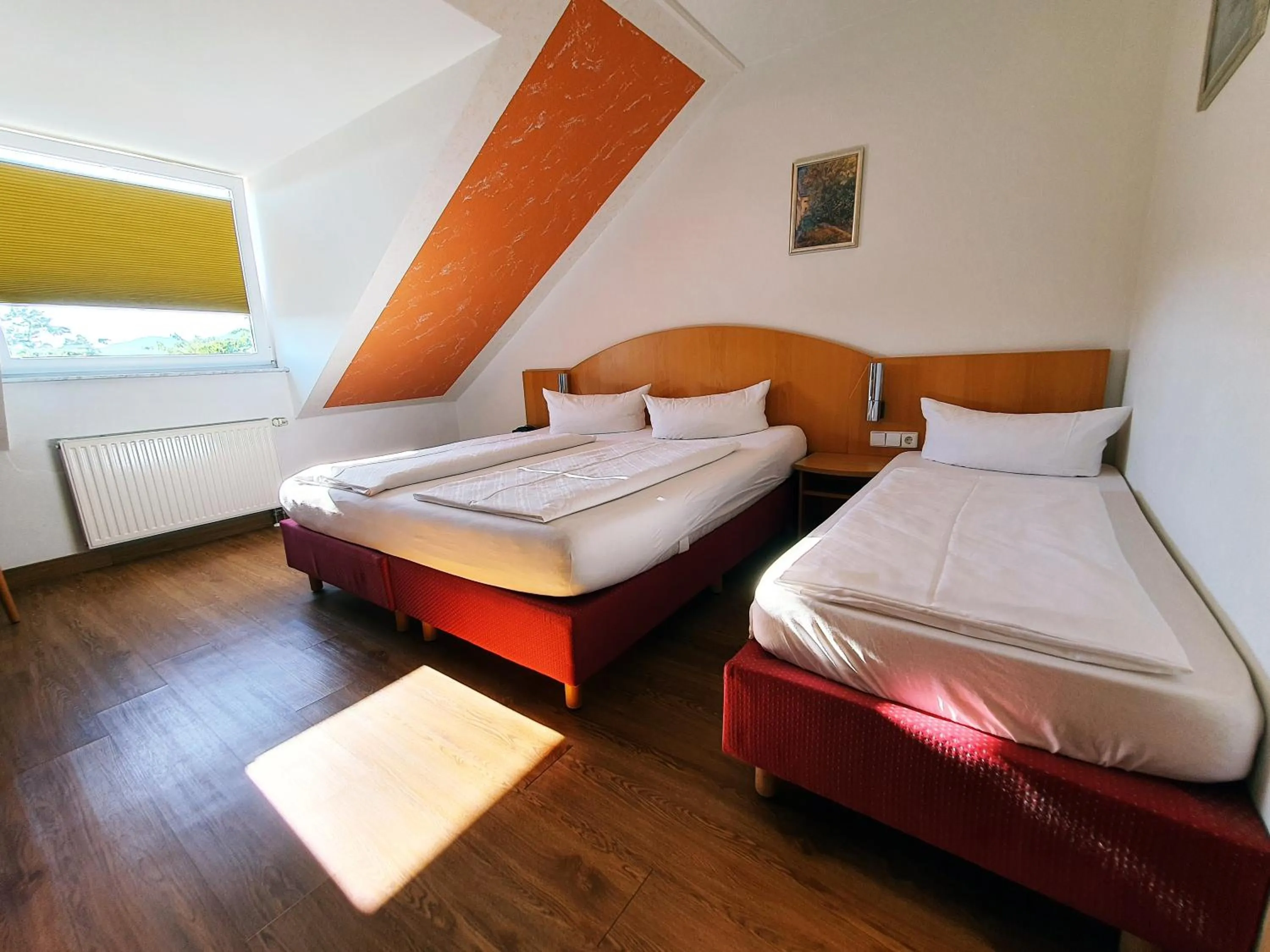 Photo of the whole room, Bed in Hotel SunParc - SHUTTLE zum Europa-Park Rust 4km & Rulantica 2km