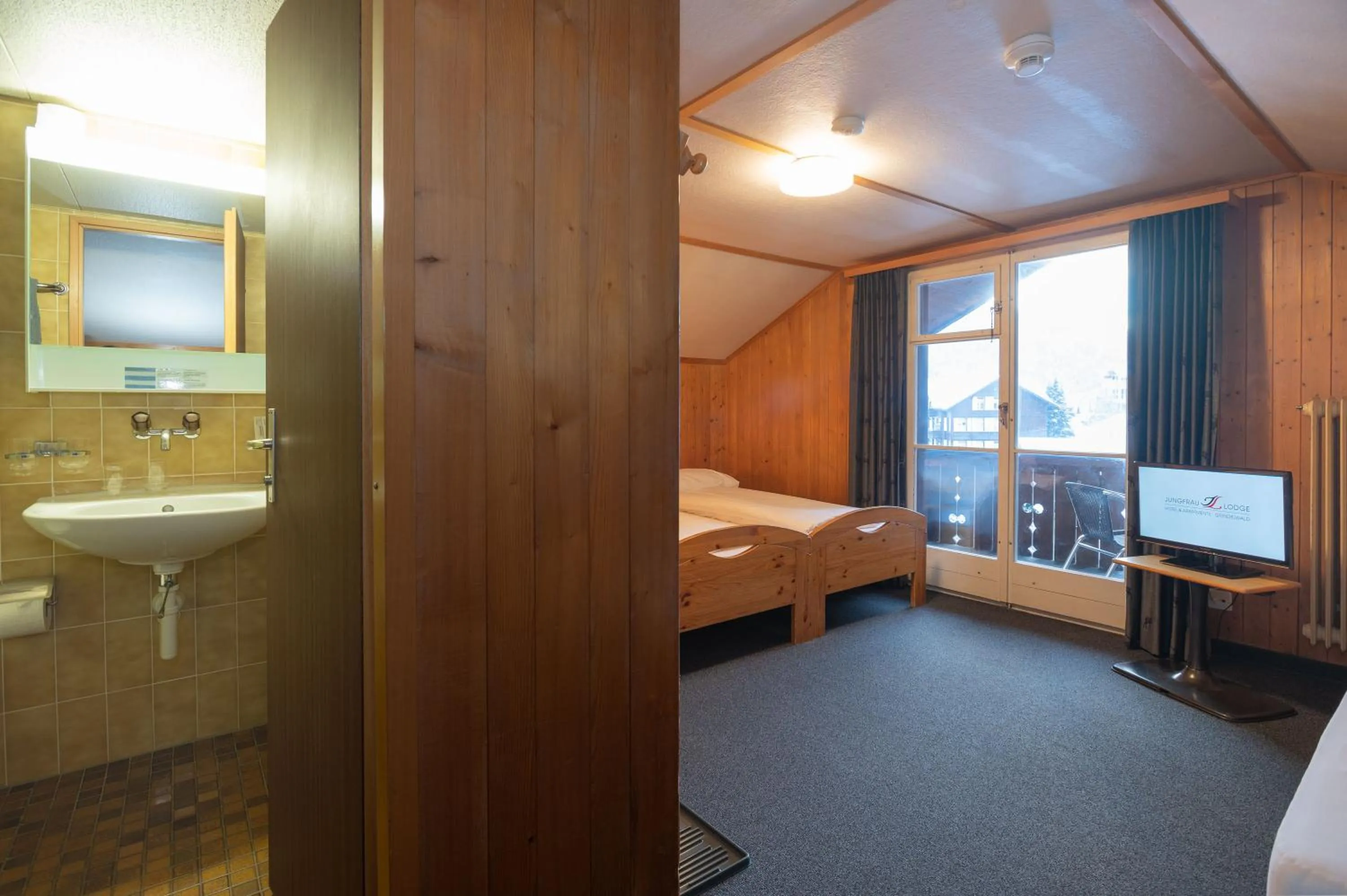 Bedroom, Bed in Jungfrau Lodge, Swiss Mountain Hotel