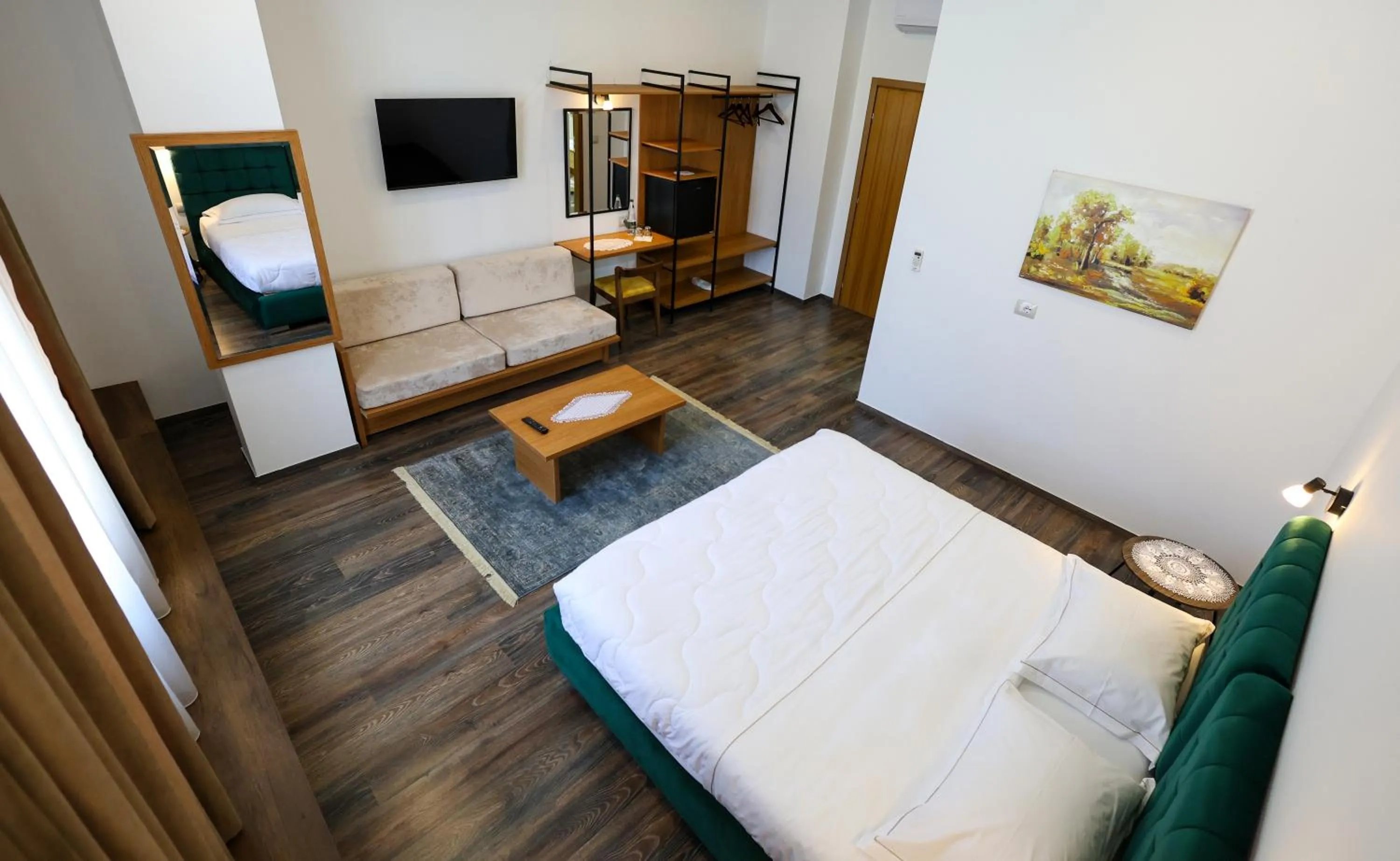 Communal lounge/ TV room, Bed in Hotel Republika Berat