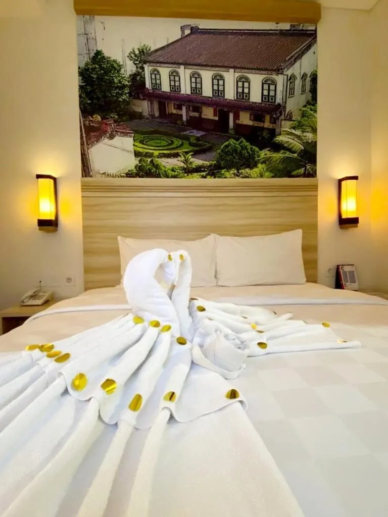 Bed in Cordela Inn Millennium Medan