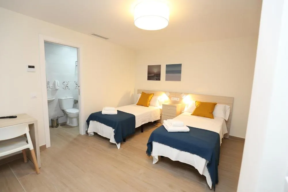 Photo of the whole room, Bed in H.PALMONES