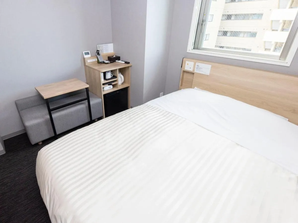 Bed in Super Hotel Sapporo Kitagojo Dori
