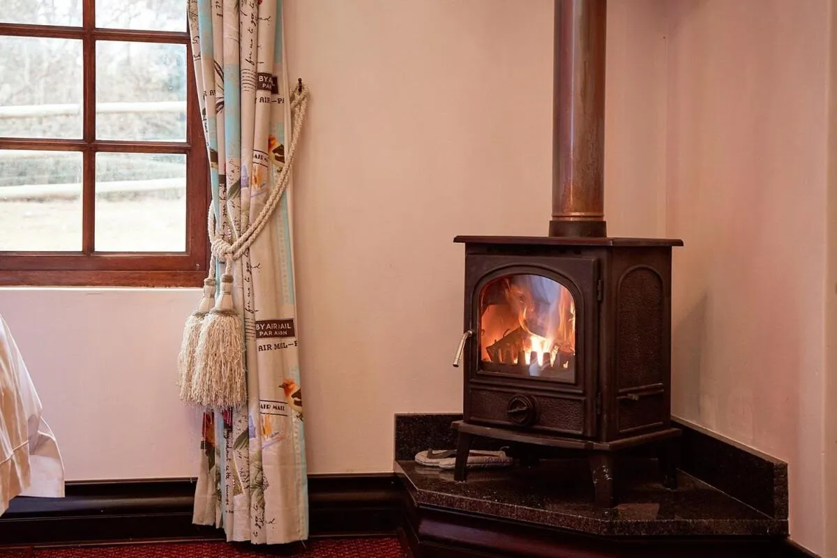 fireplace in Bergview Farm Cottage by First Private Stays