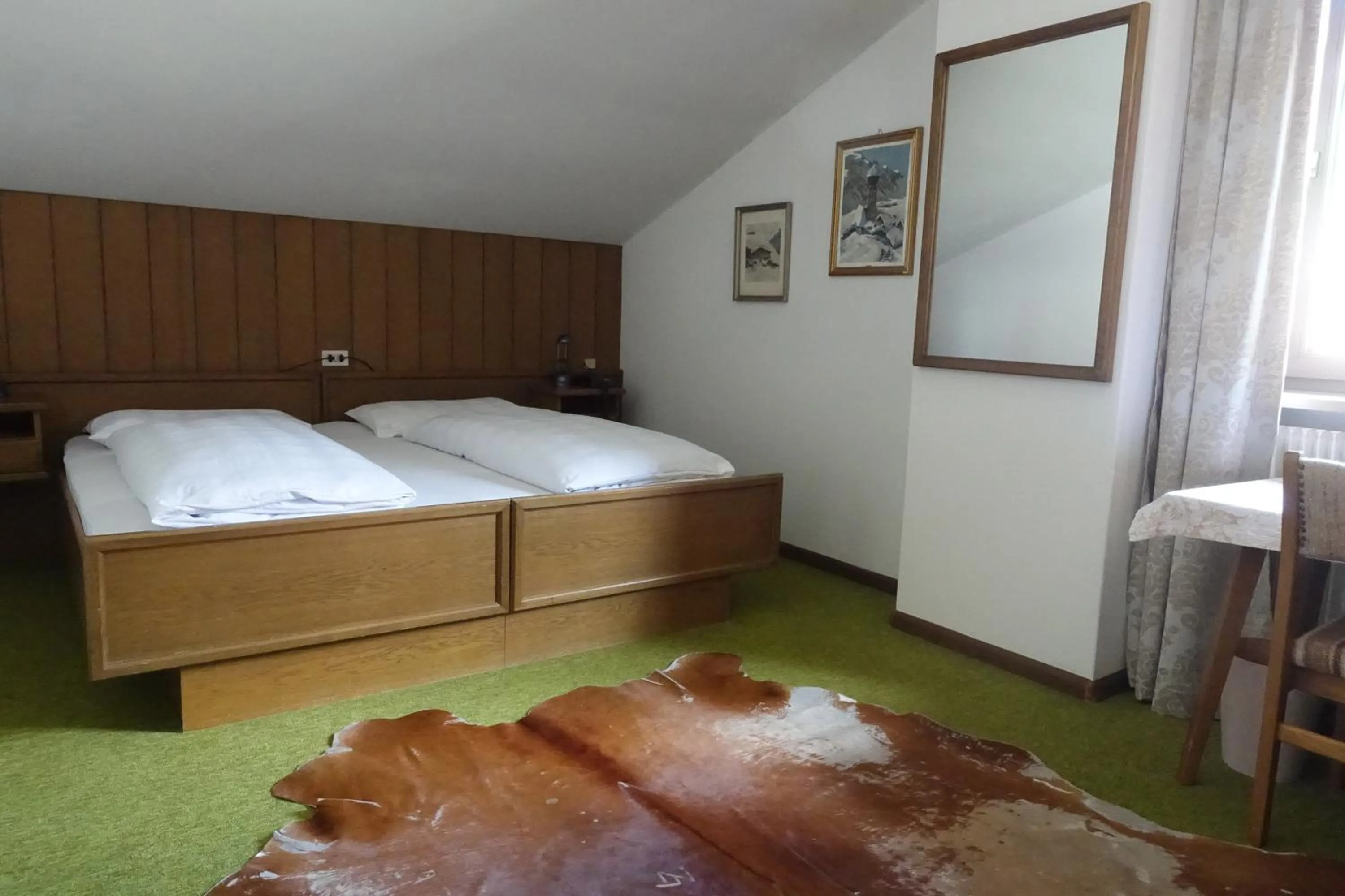 Bed in Pension Dolomieu