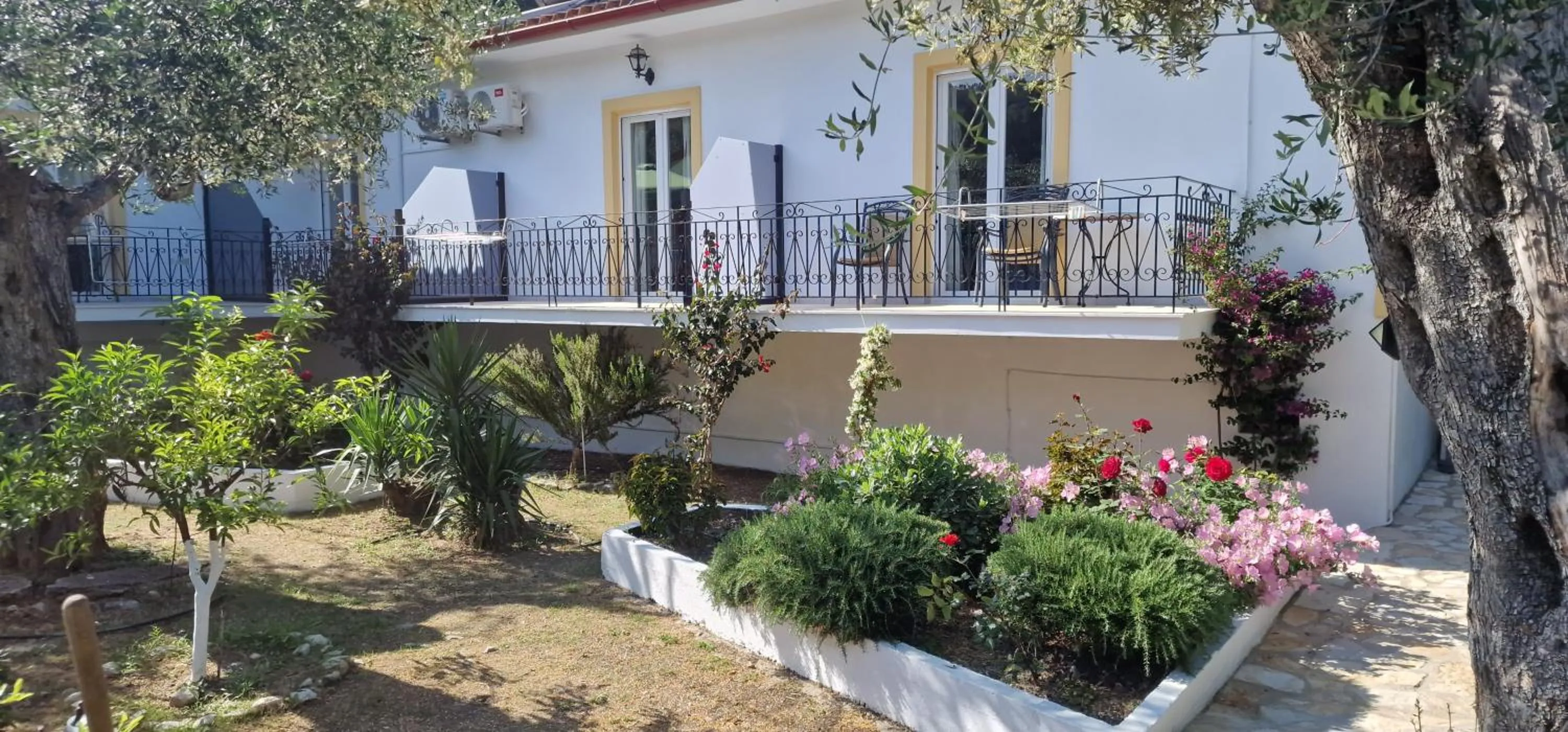 Garden in LIvadi Studios with Pool