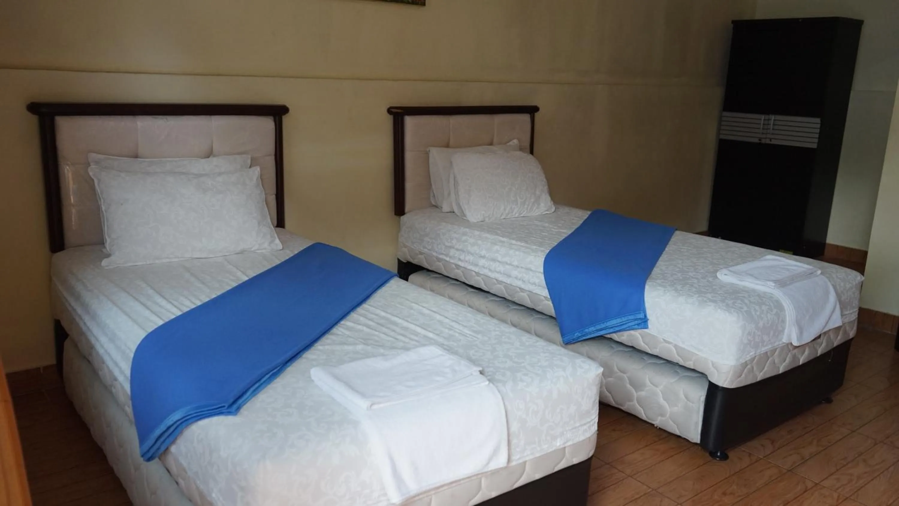 Garden view, Bed in BRIA Hotel & Convention