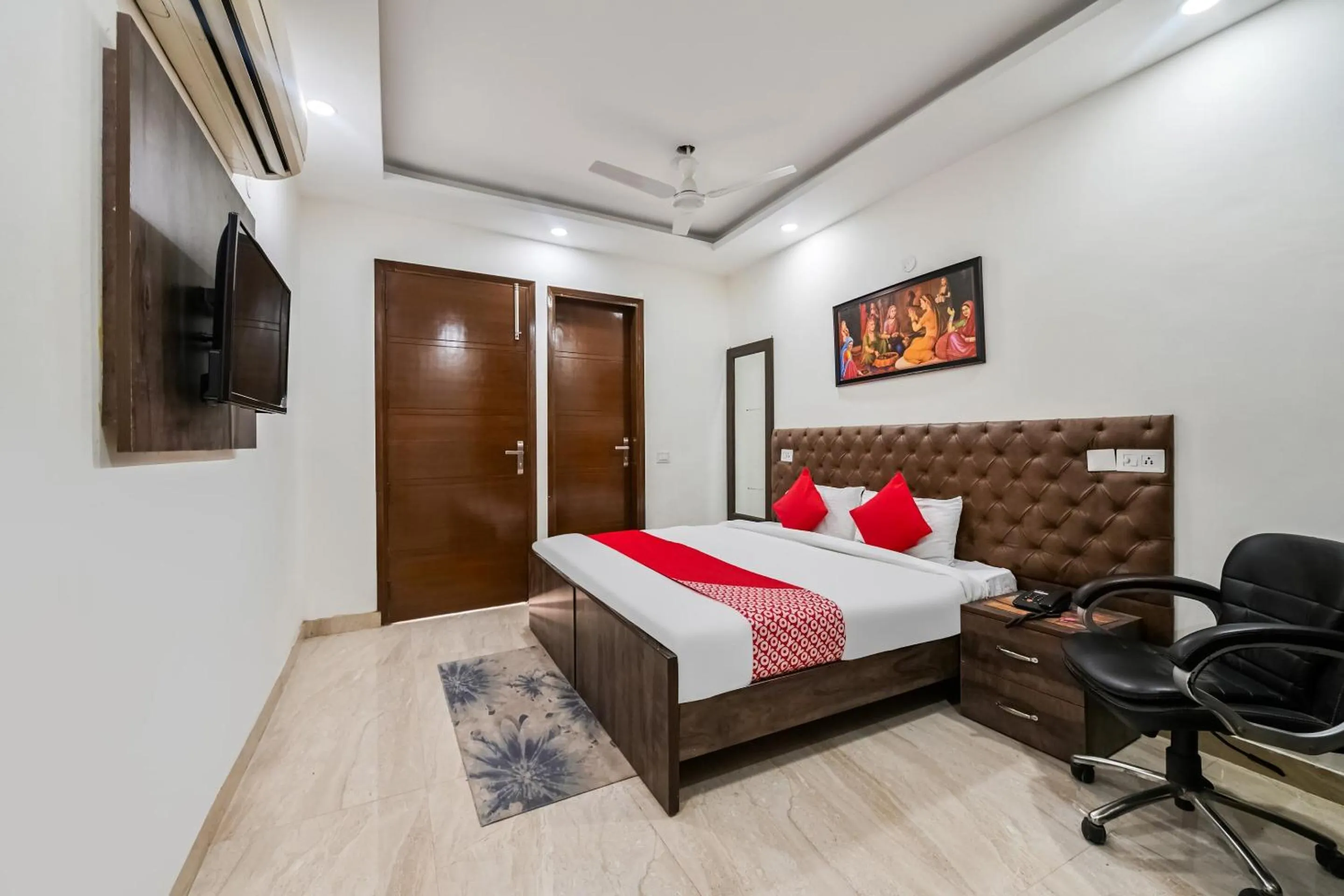 Bedroom in OYO White Rose Wallon Hotel Near Qutab Minar Metro Station
