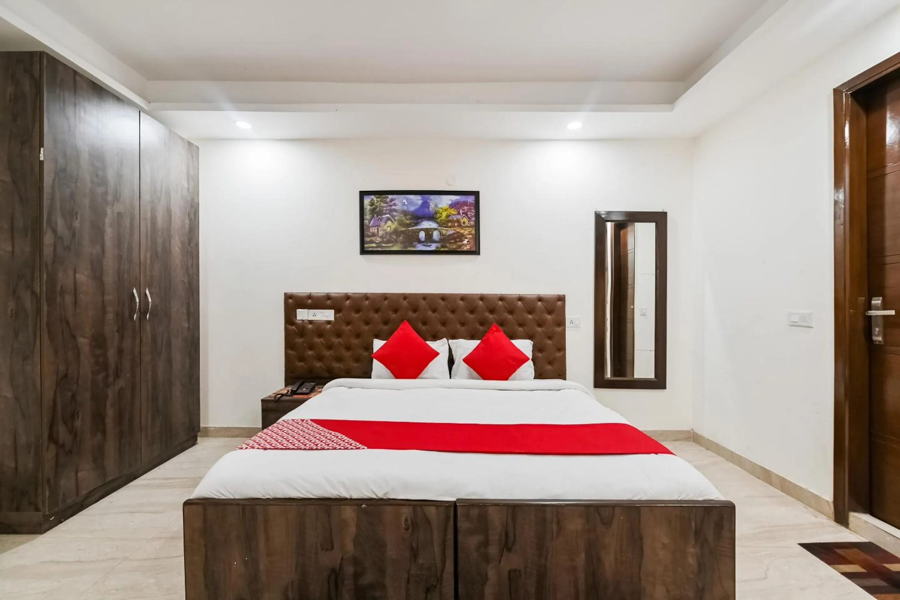 Bedroom in OYO White Rose Wallon Hotel Near Qutab Minar Metro Station