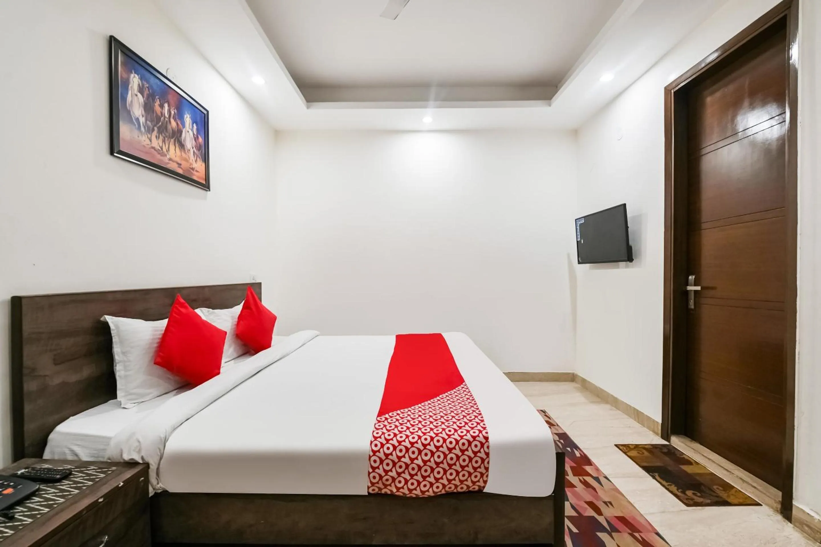 Bedroom in OYO White Rose Wallon Hotel Near Qutab Minar Metro Station