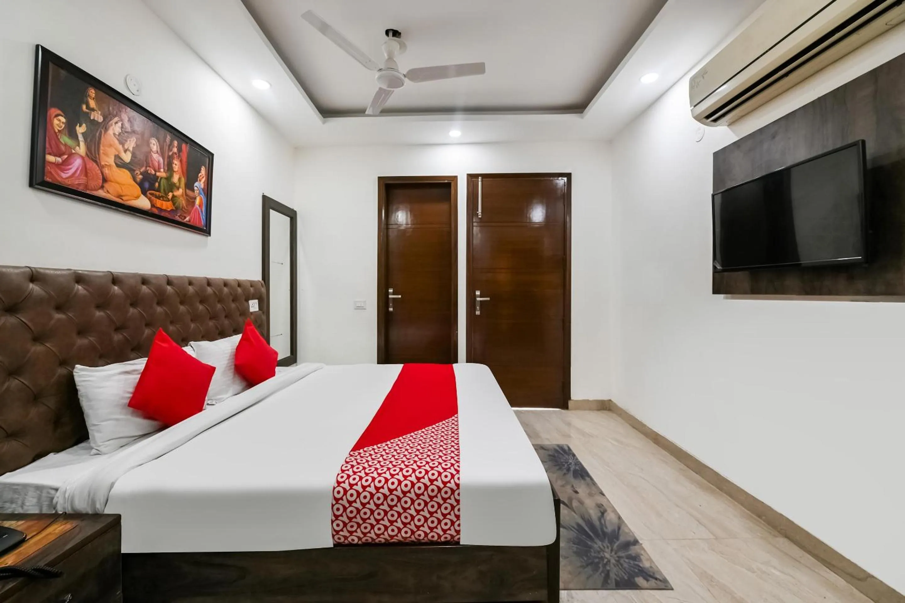 Bedroom in OYO White Rose Wallon Hotel Near Qutab Minar Metro Station