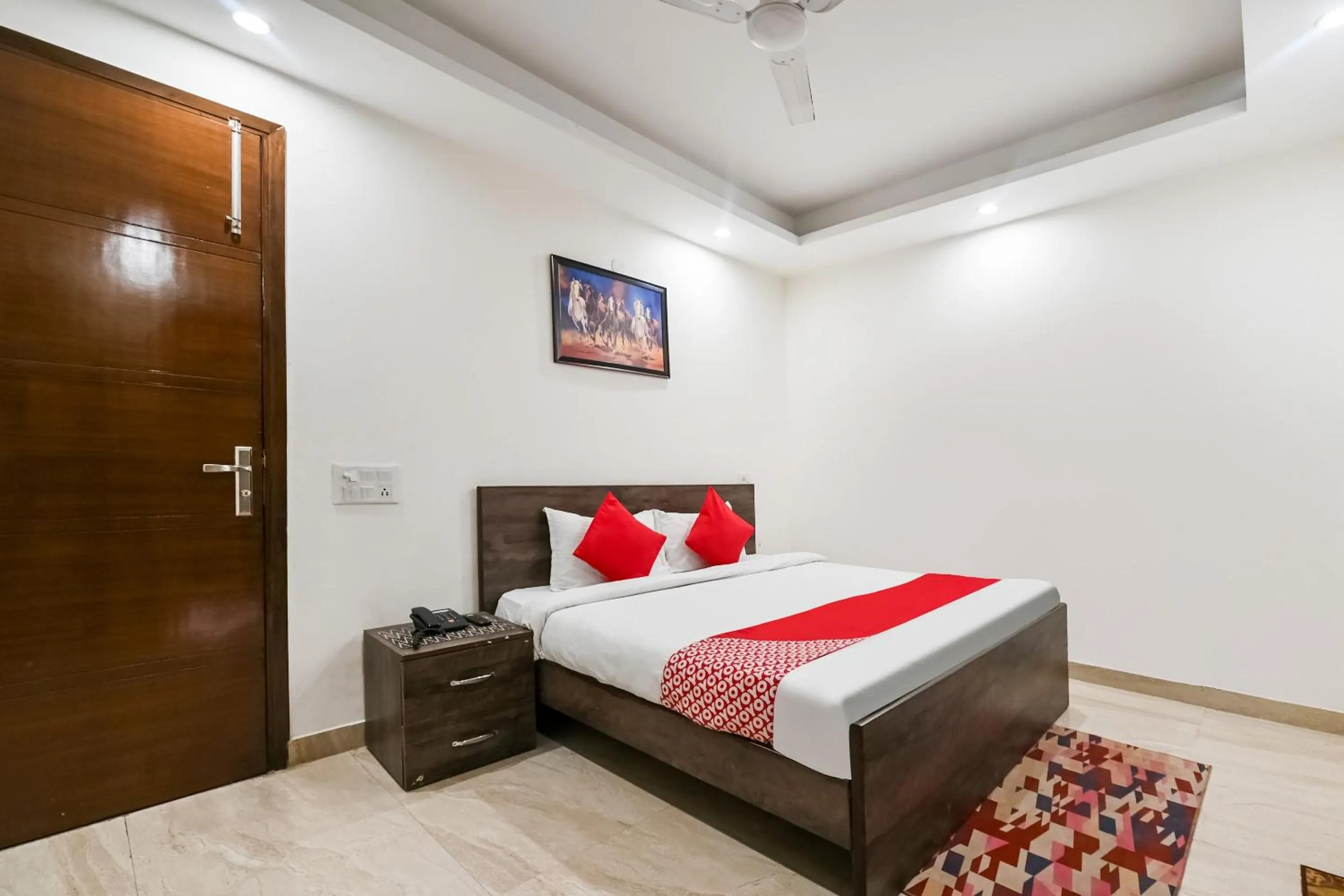 Bedroom in OYO White Rose Wallon Hotel Near Qutab Minar Metro Station