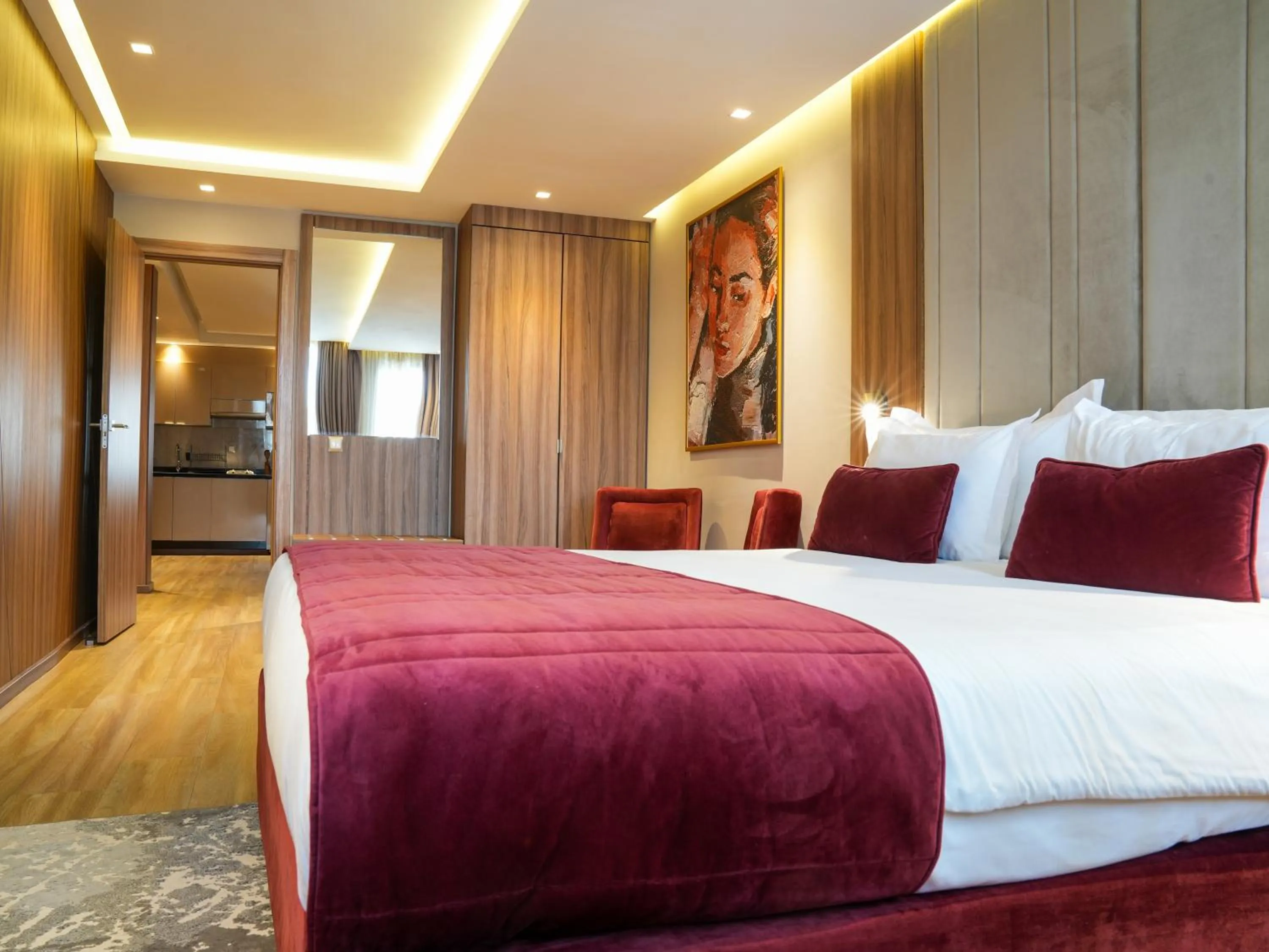 Bed in First Suites Hôtel