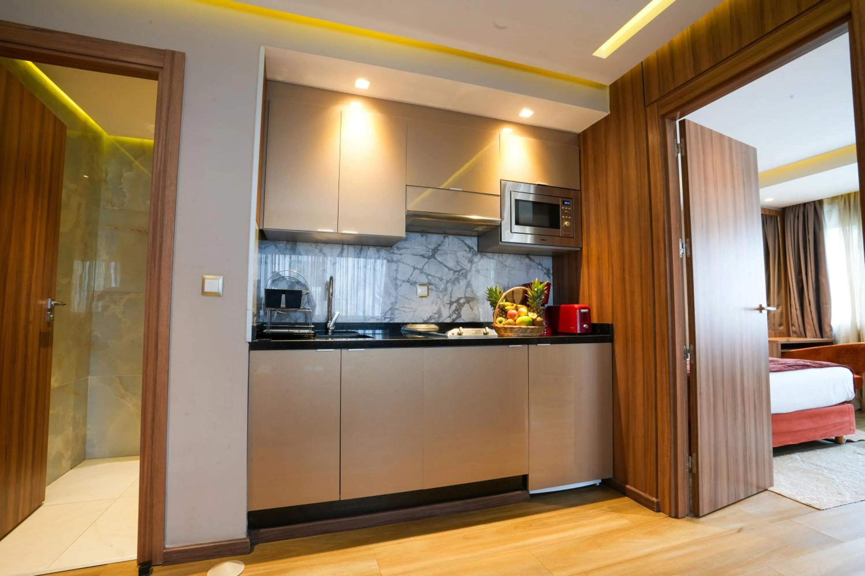 Kitchen or kitchenette in First Suites Hôtel