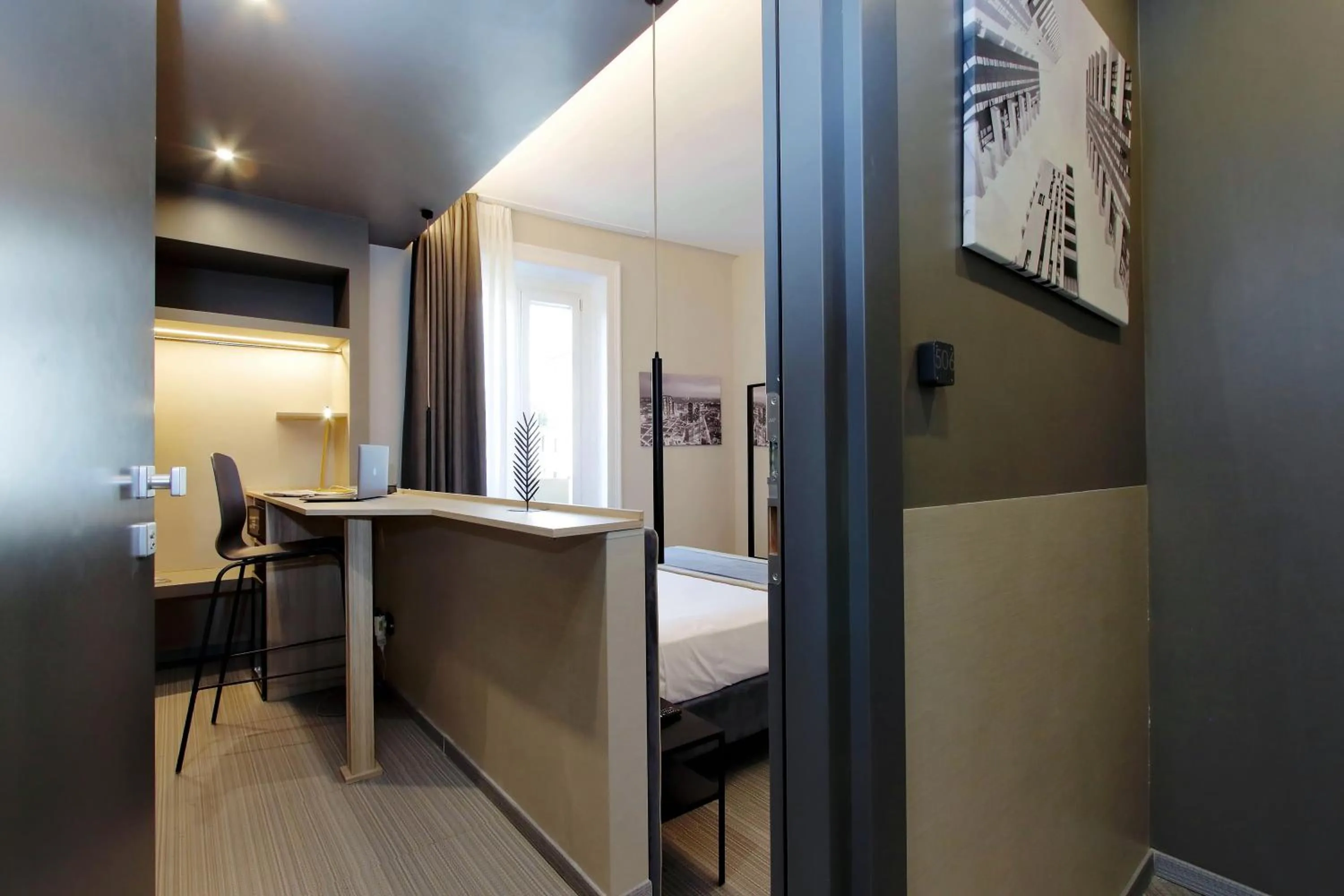 Photo of the whole room, Bed in Vico Fashion District