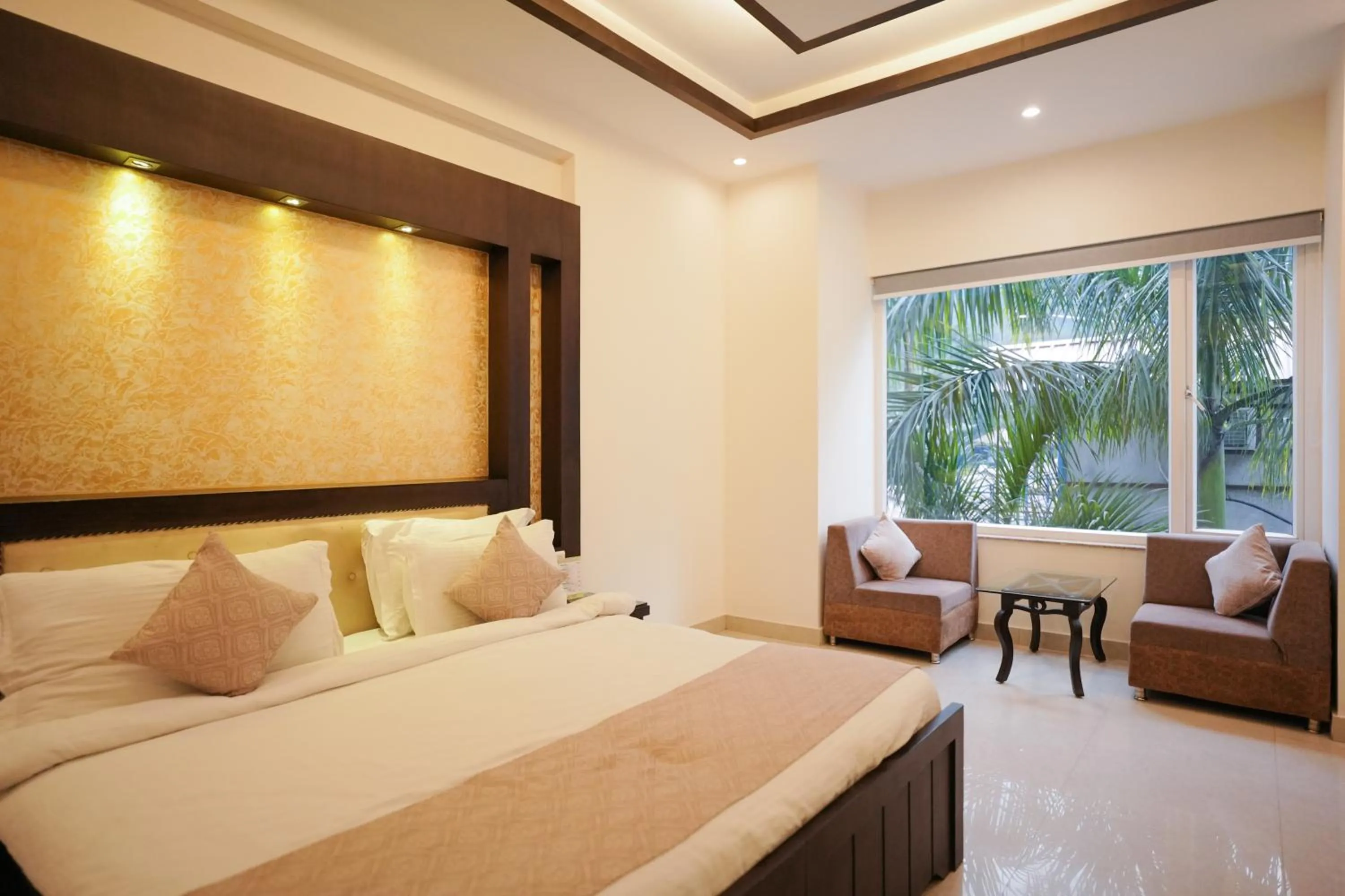 Bed in The Grand Shiva Resort and Spa