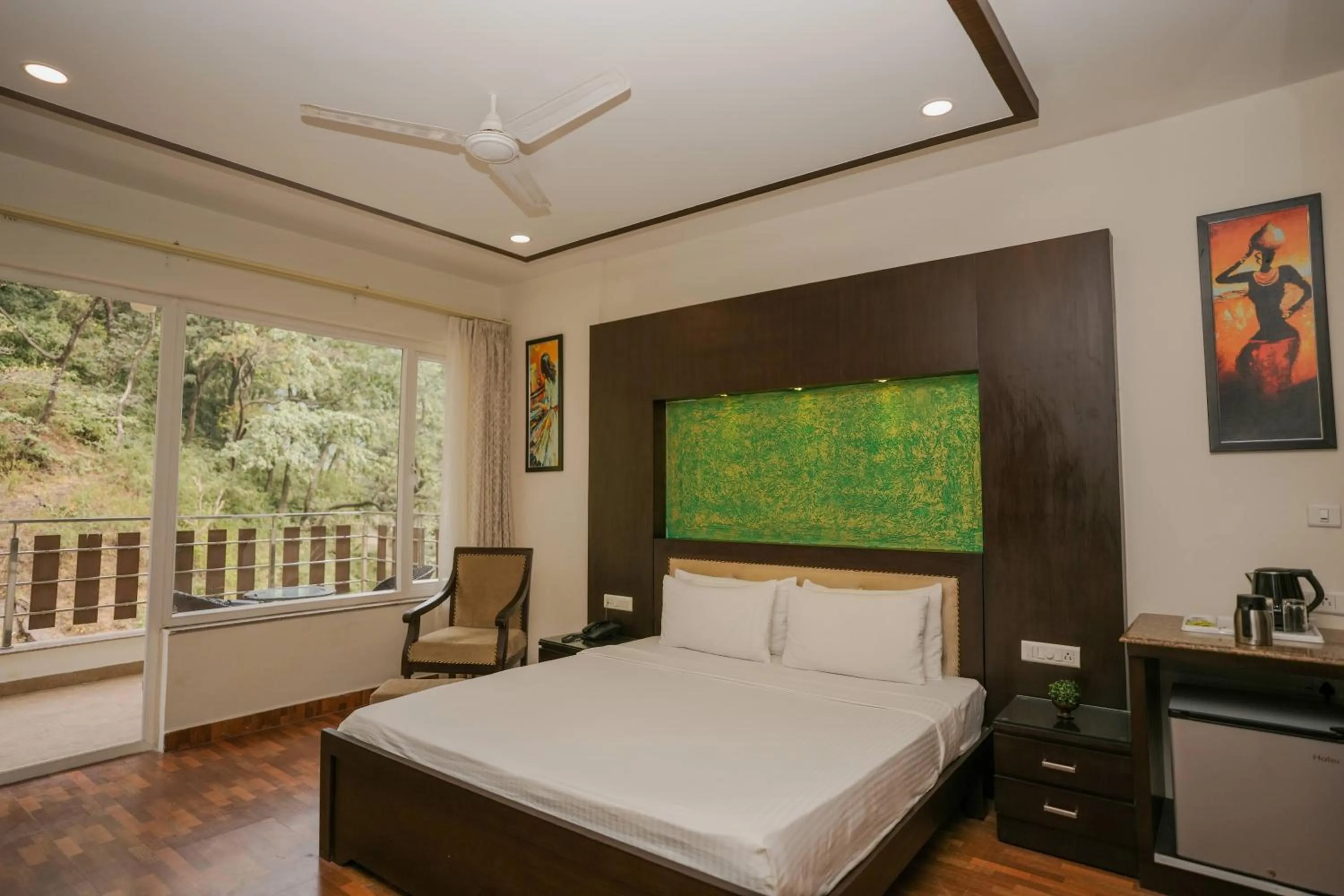 Bed in The Grand Shiva Resort and Spa