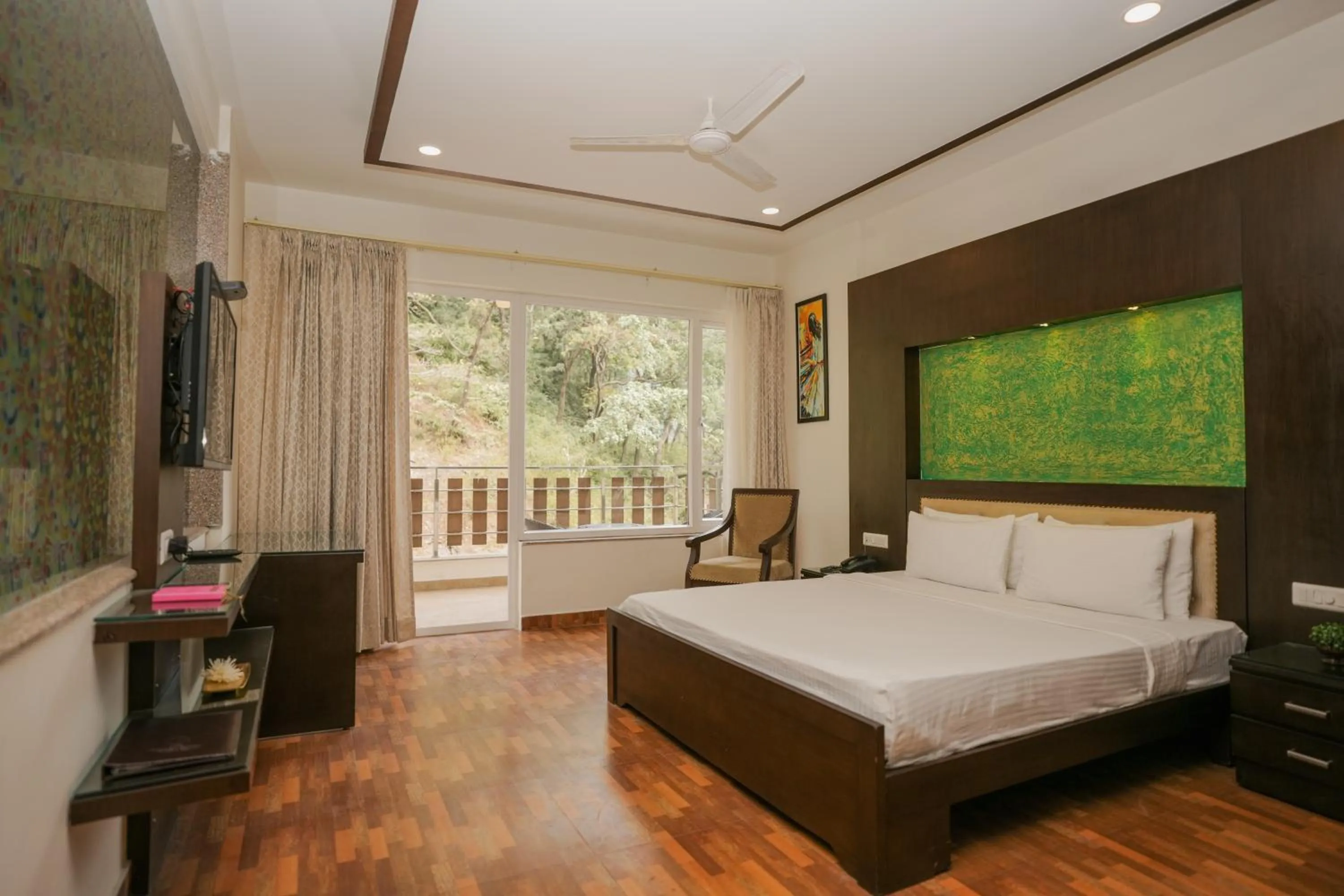 Bed in The Grand Shiva Resort and Spa